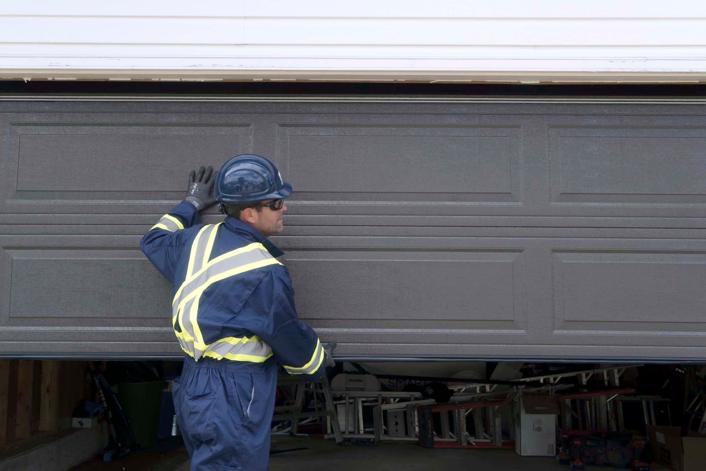 a cds technicians installing a new garage door