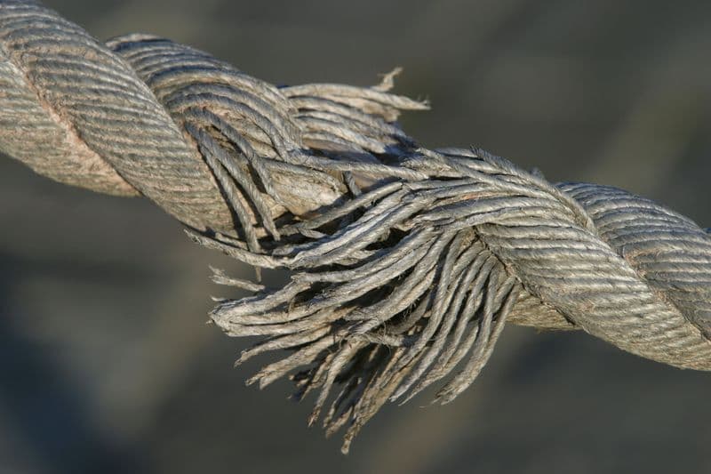close up of a frayed pulley cable