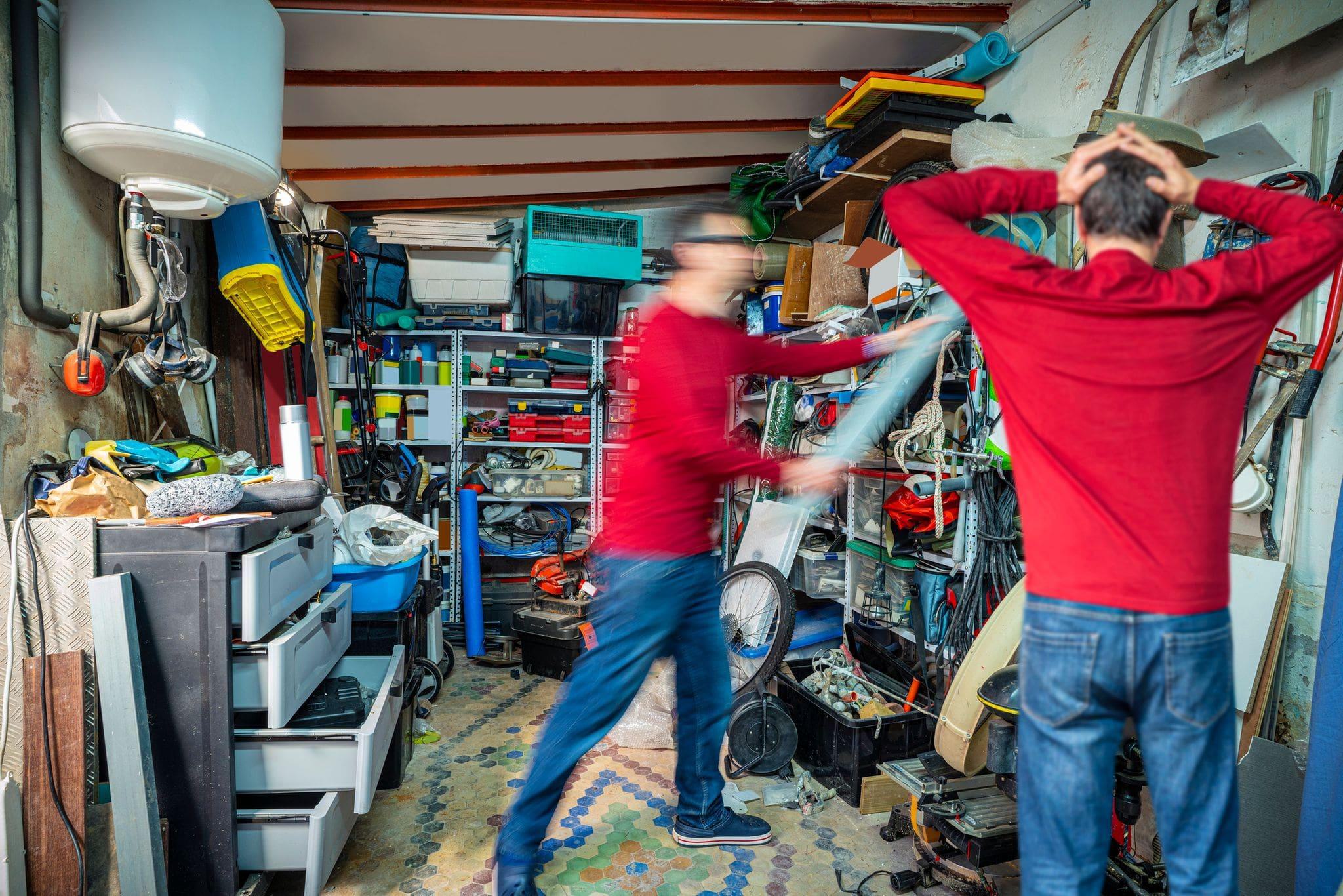 frantically cleaning a very messy and cluttered garage