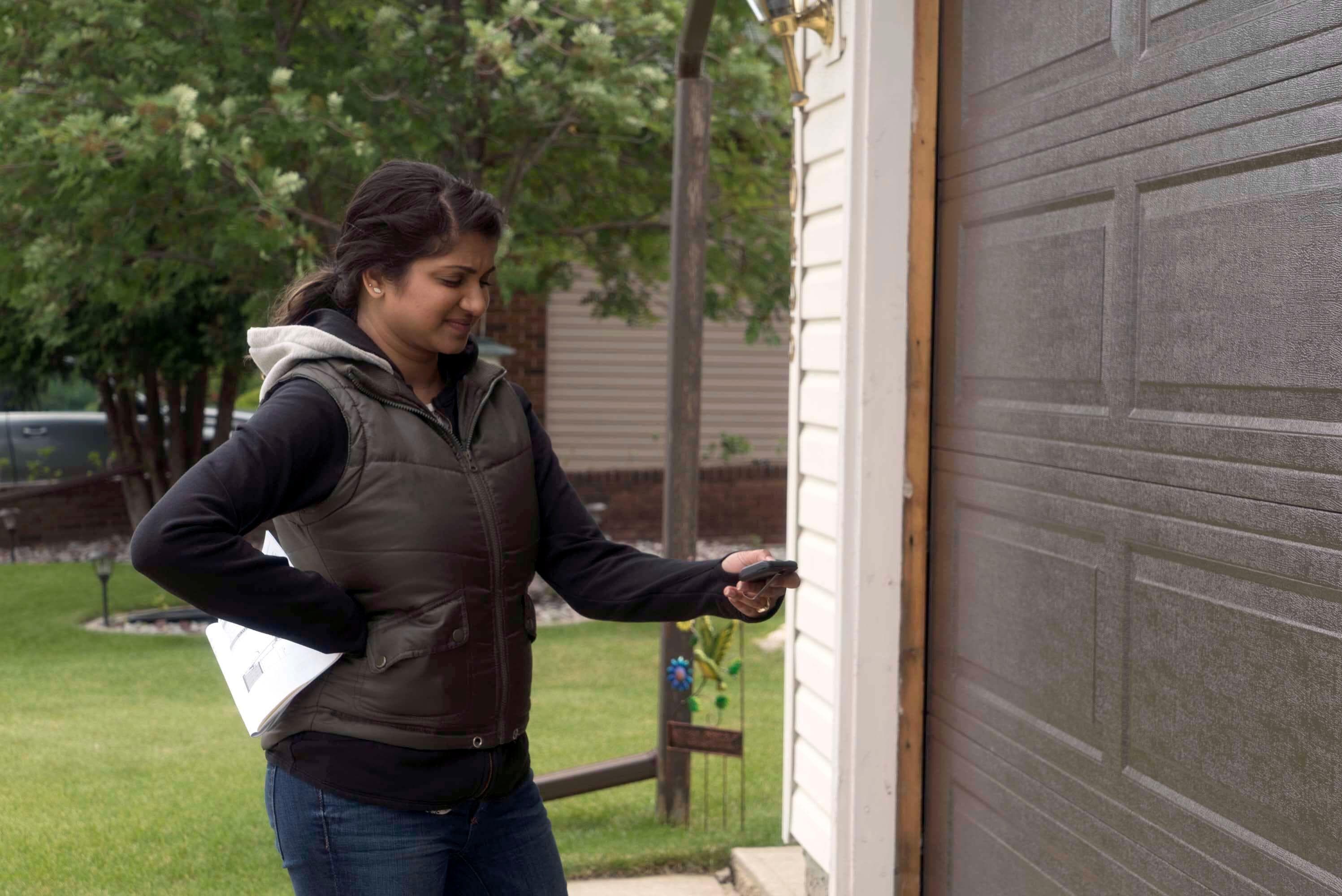 woman frustrated with her garage door opener
