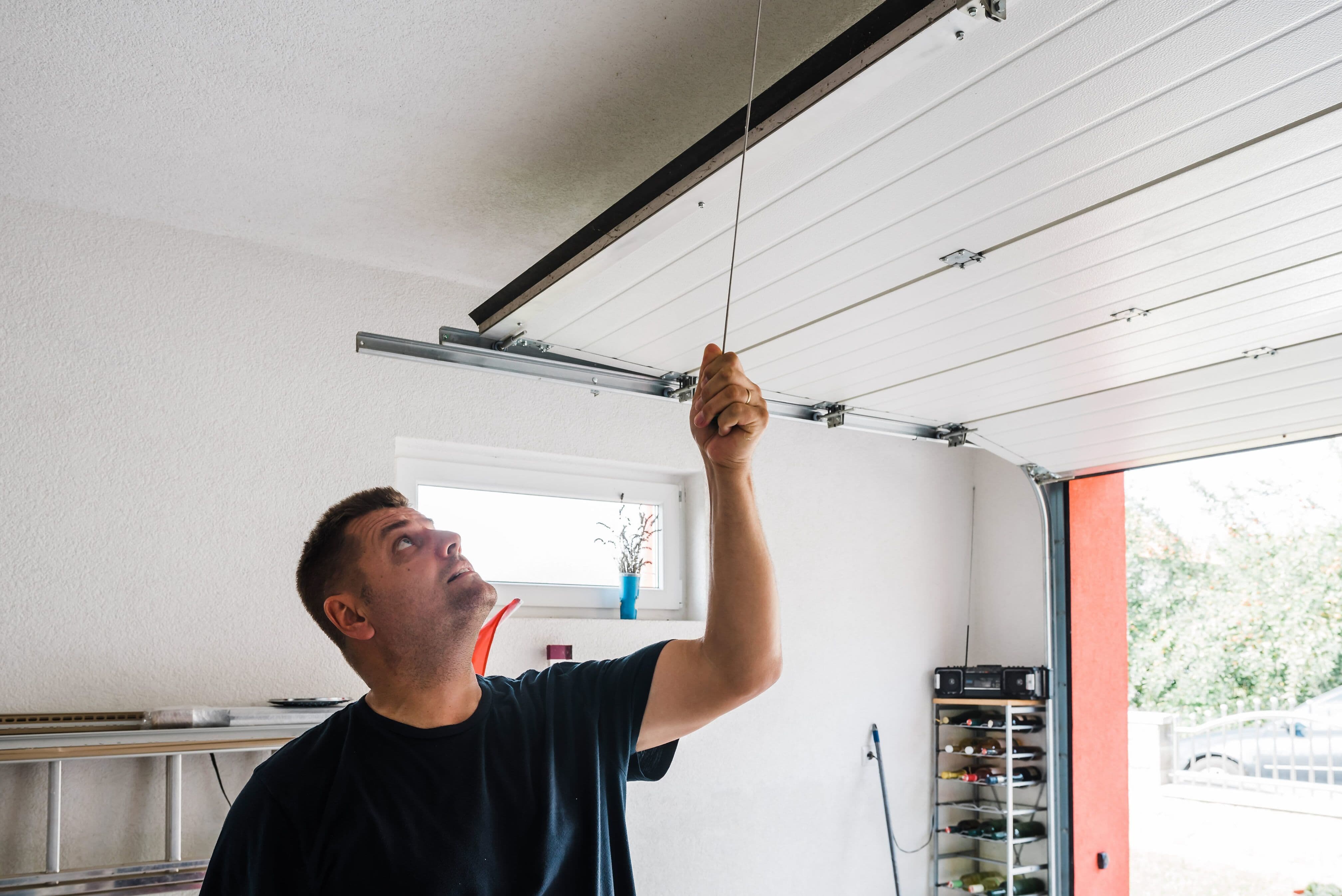 troubleshooting your unbalanced garage door begins with performing a balance test