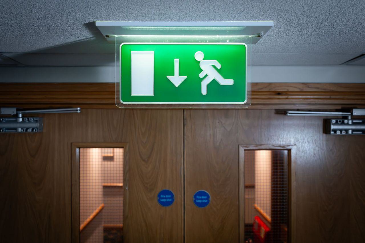 green elementary school emergency fire exit sign