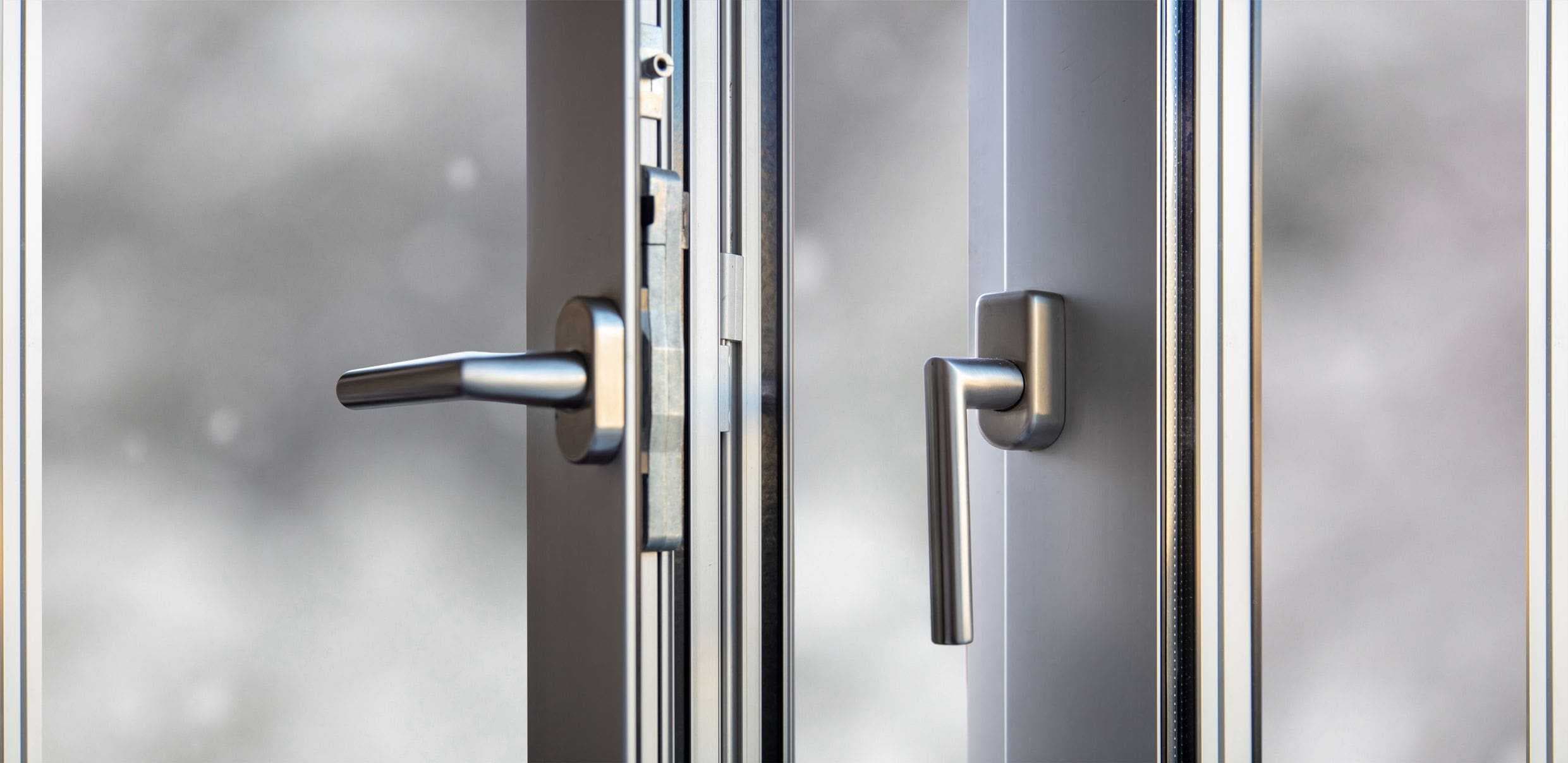 close up of locks and handles on steel pedestrian door