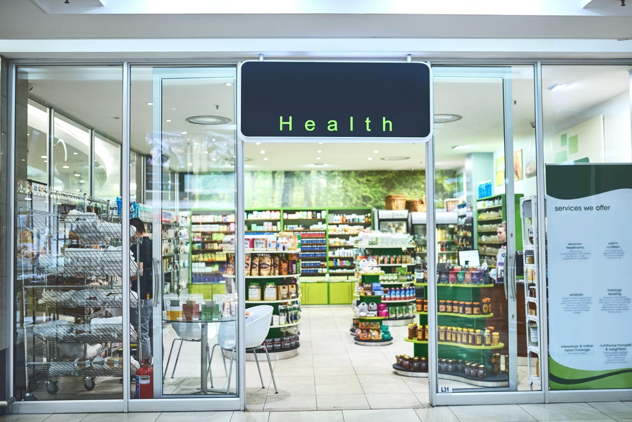 interior mall health store with sliding automatic glass doors