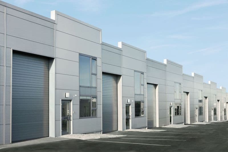 row of warehouse docking stations with rolling doors
