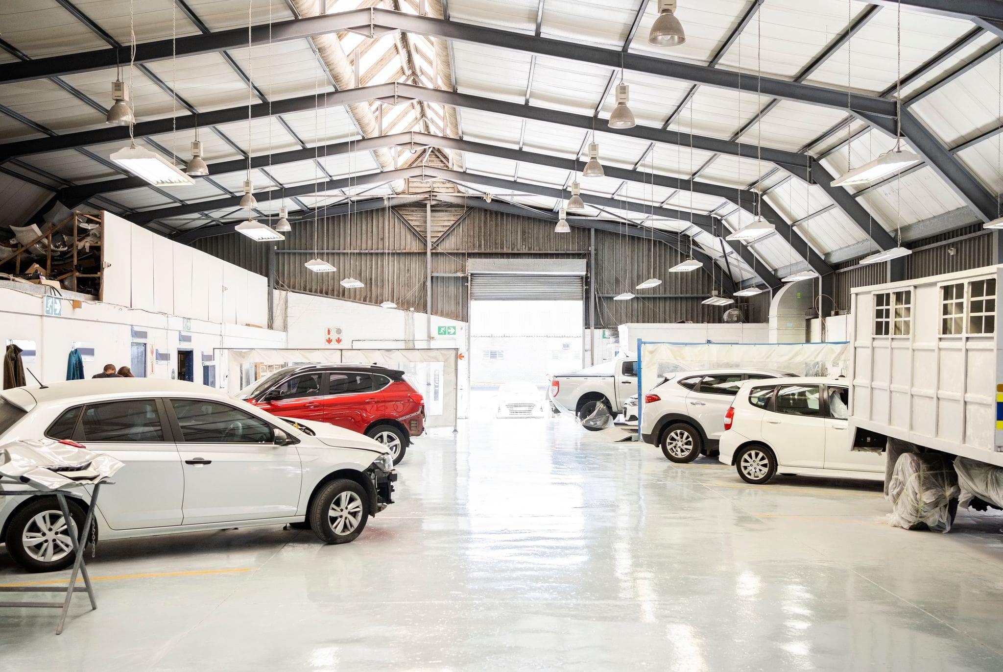interior of an auto dealership service center with commercial overhead doors interior of an auto dealership service center with commercial overhead doors