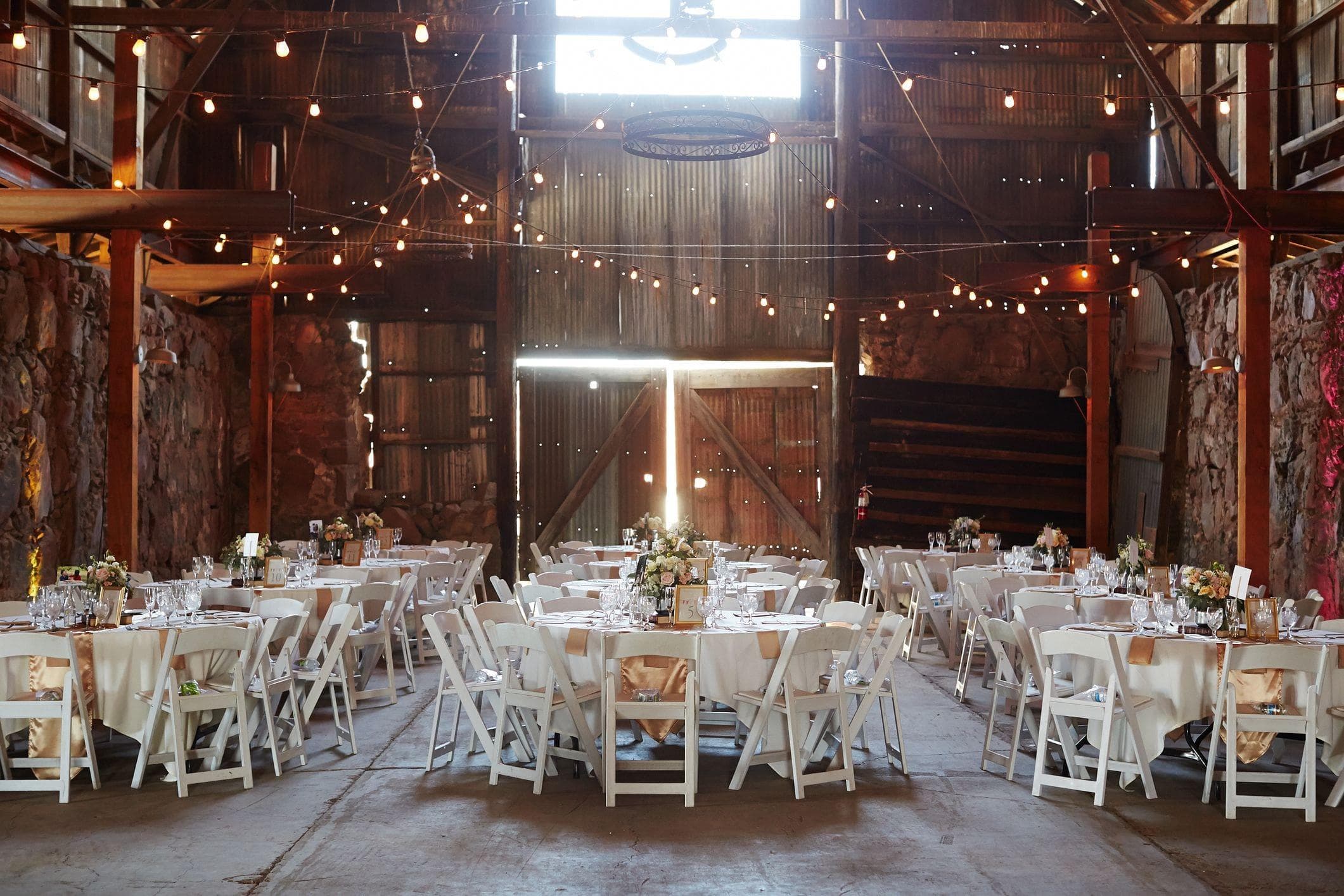 gorgeous wedding venue set up inside of barn event space