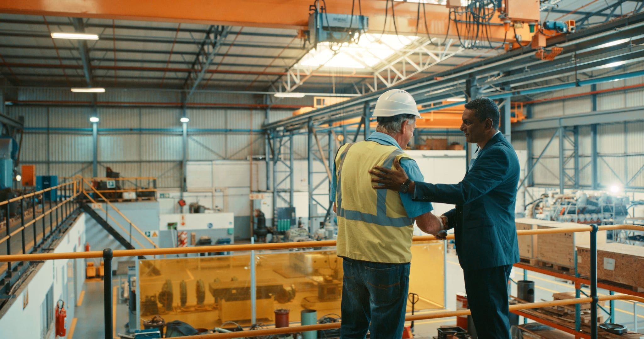 handshake inside of vancouver shipping hub and warehouse