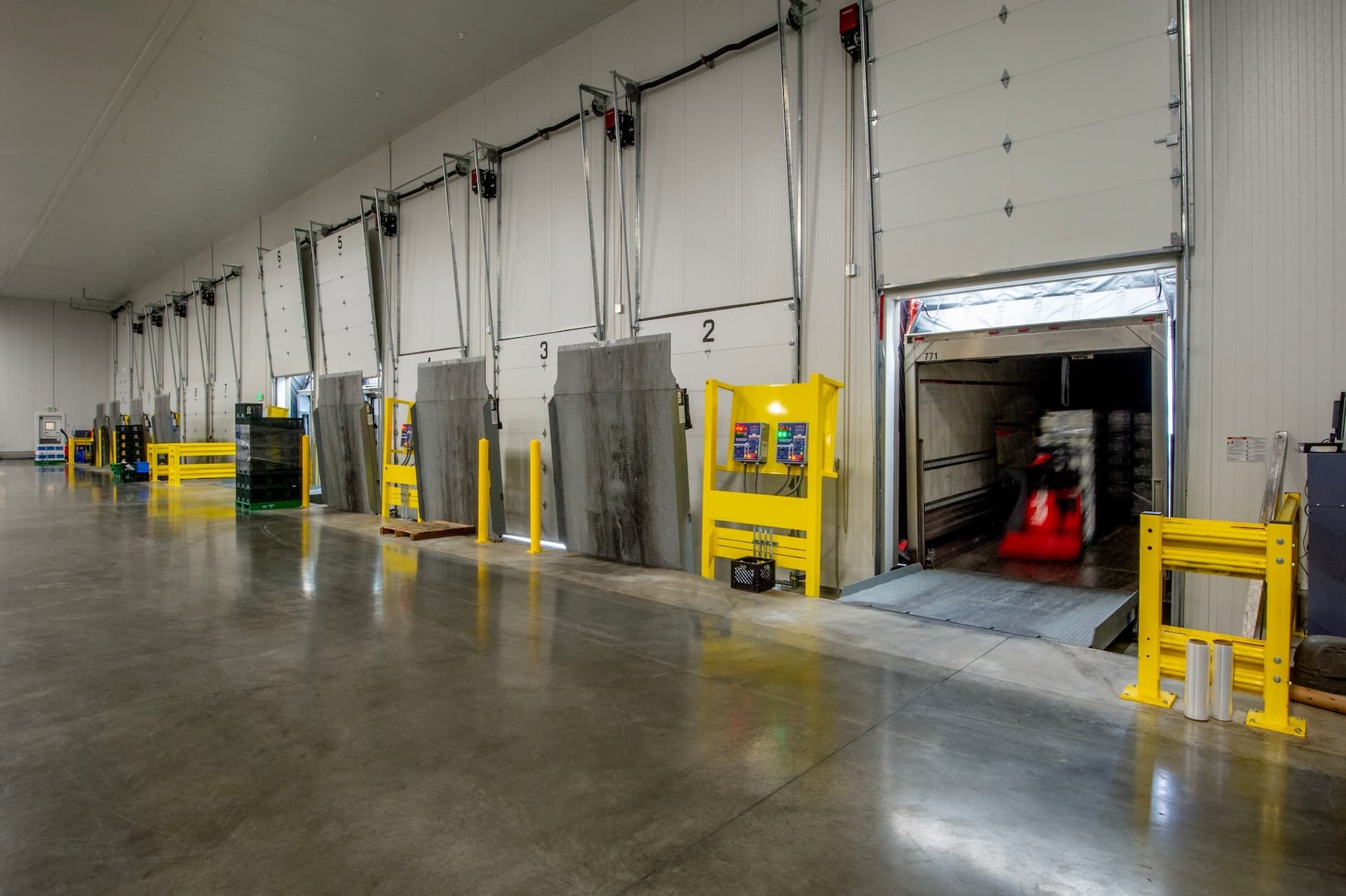 loading goods from warehouse onto docked truck
