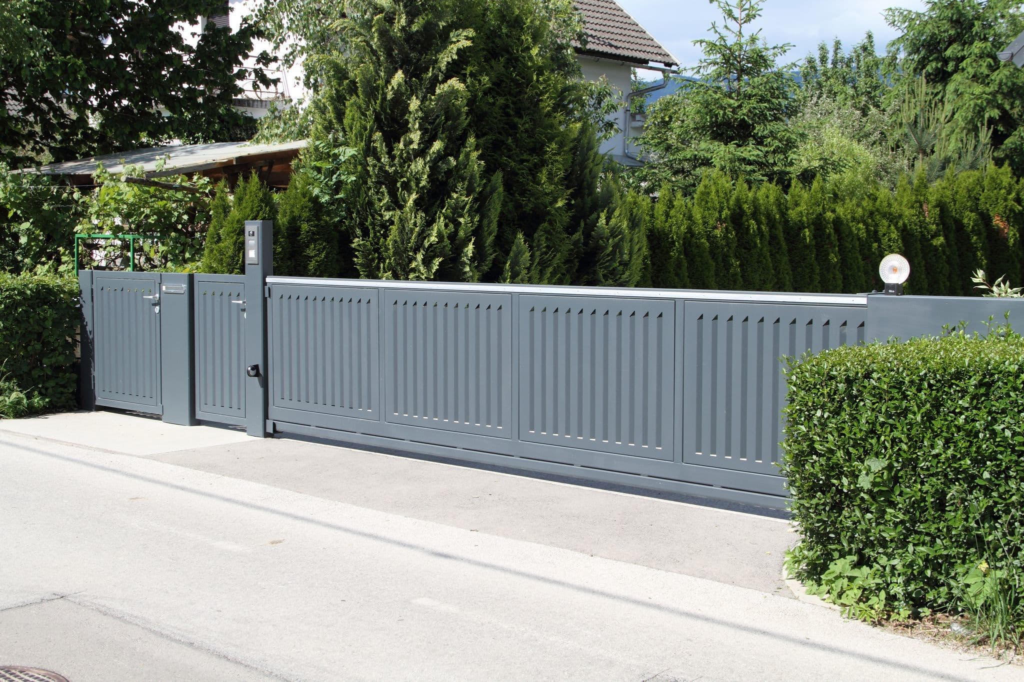 a long grey stacker gate in a residential neighbourhood