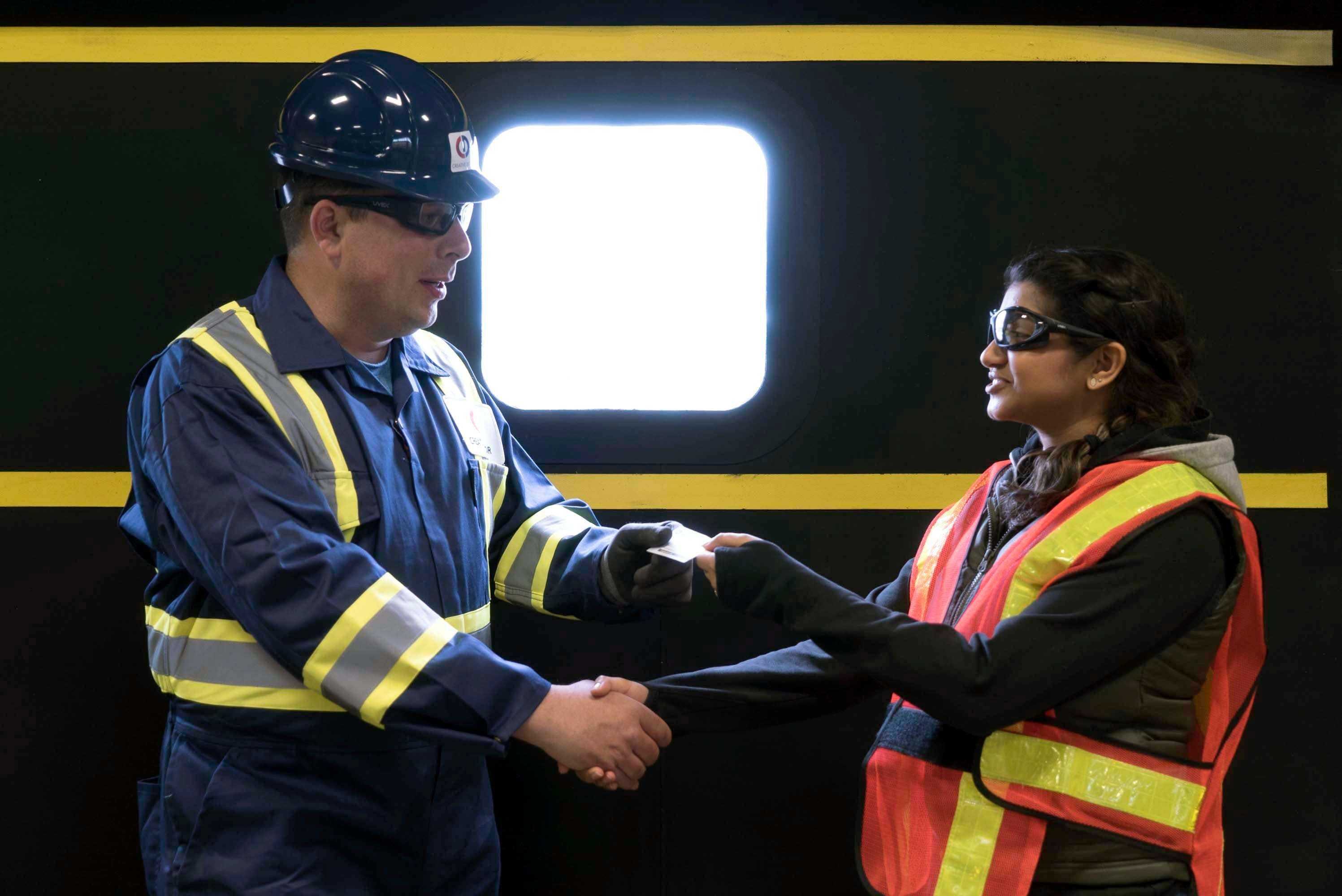 meeting with a technician from creative door in a warehouse setting meeting with a technician from creative door in a warehouse setting