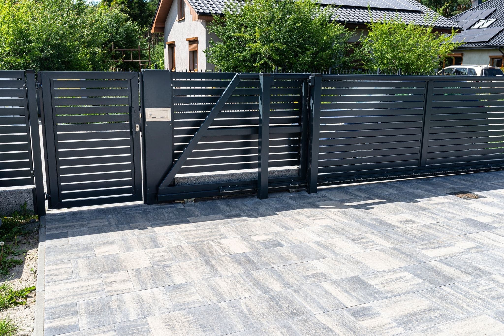 a modern black automatic residential gate