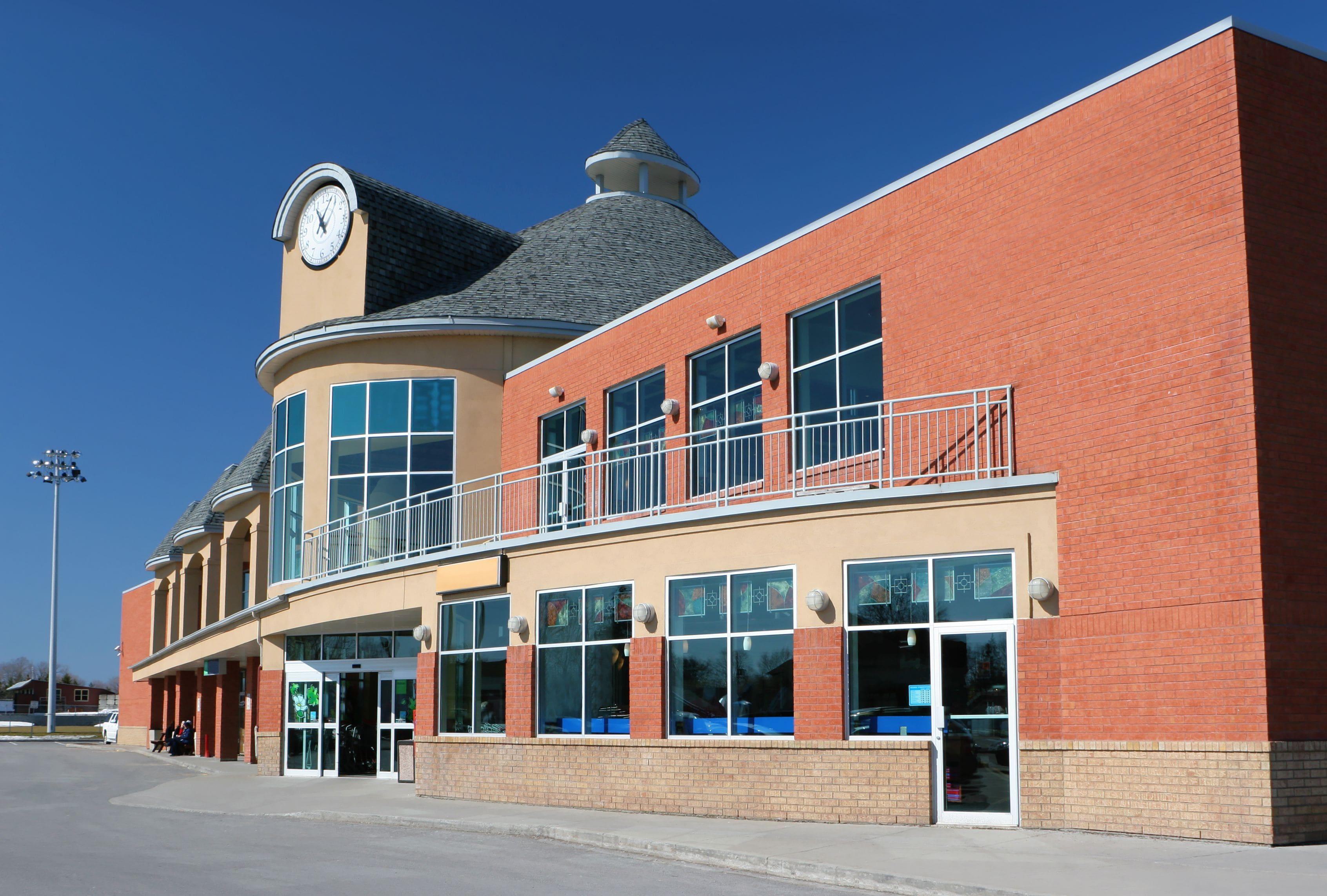 a modern supermarket storefront with glass entry way and windows a modern supermarket storefront with glass entry way and windows