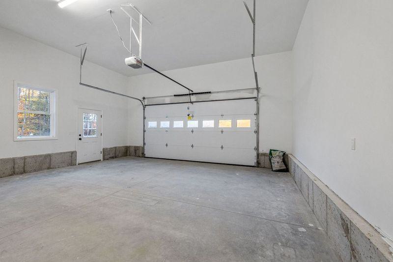 new construction interior view of garage door and operator with middle row of glass windows