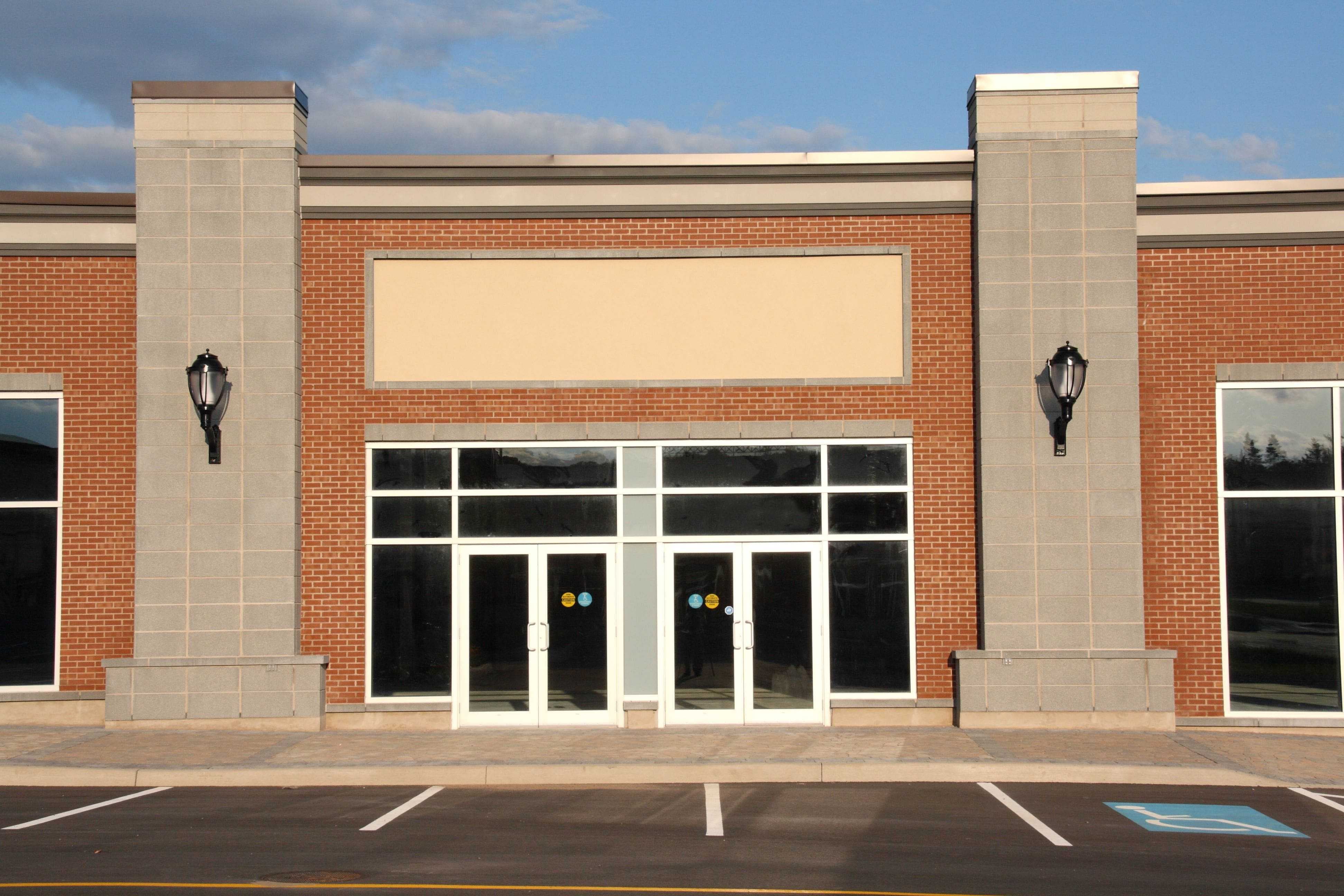 brand new exterior strip mall storefront with pedestrian doors
