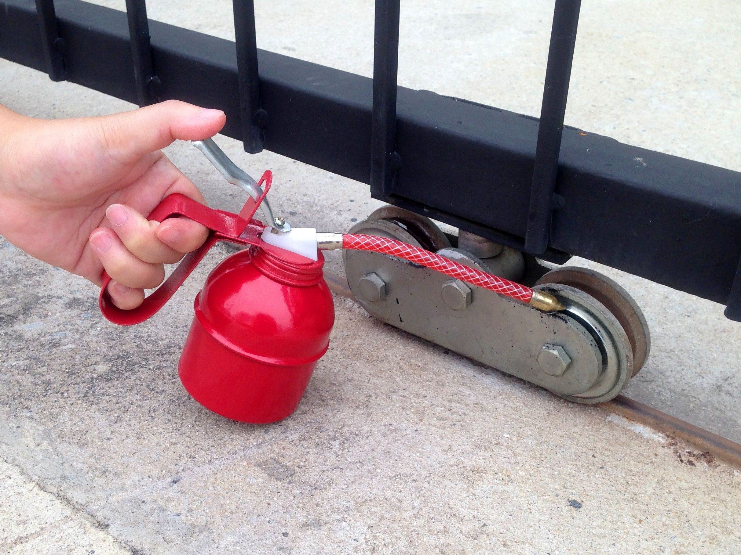 using lubricant on roller for slide gate tracks