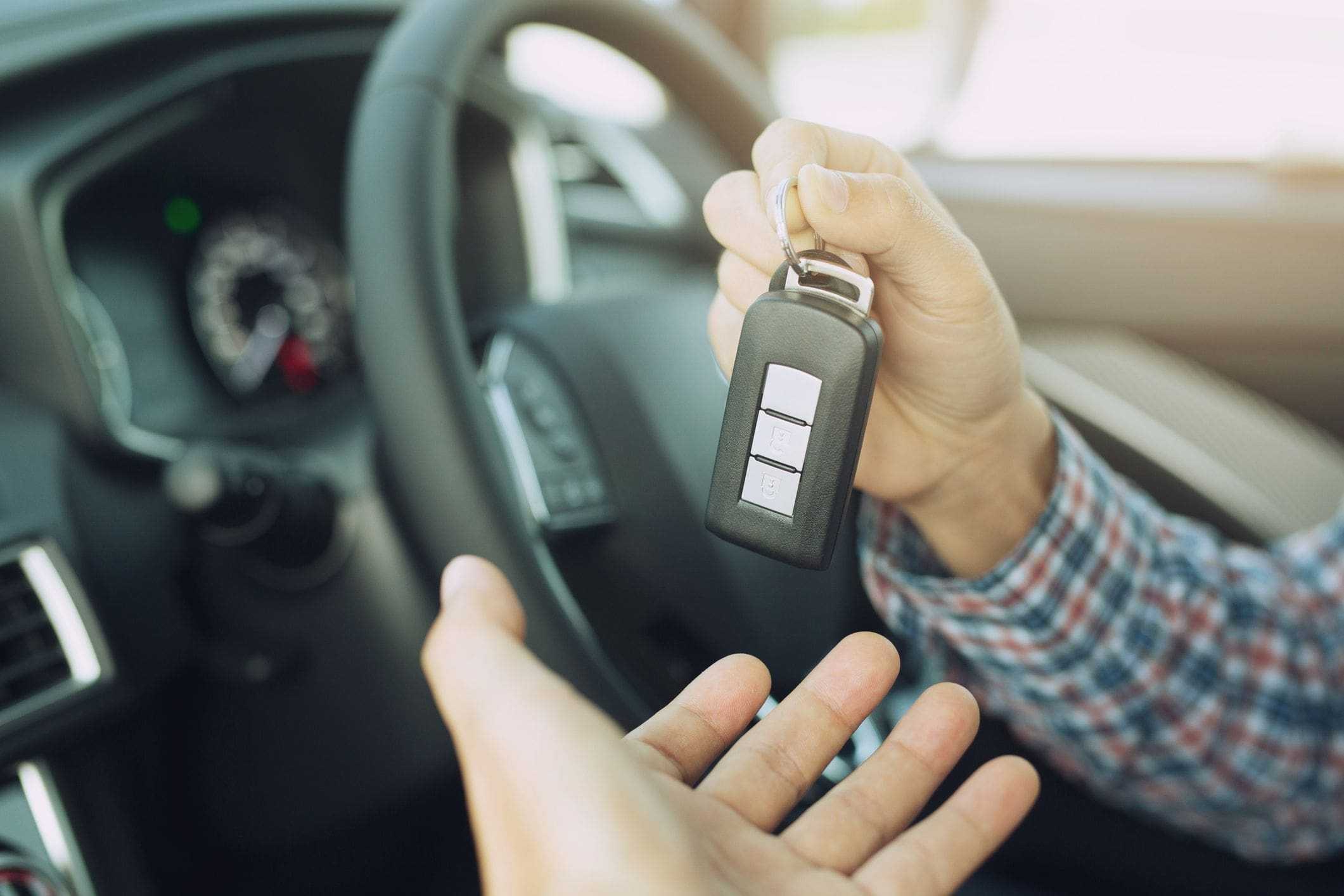showing off opener remote on key chain while sitting inside car showing off opener remote on key chain while sitting inside car