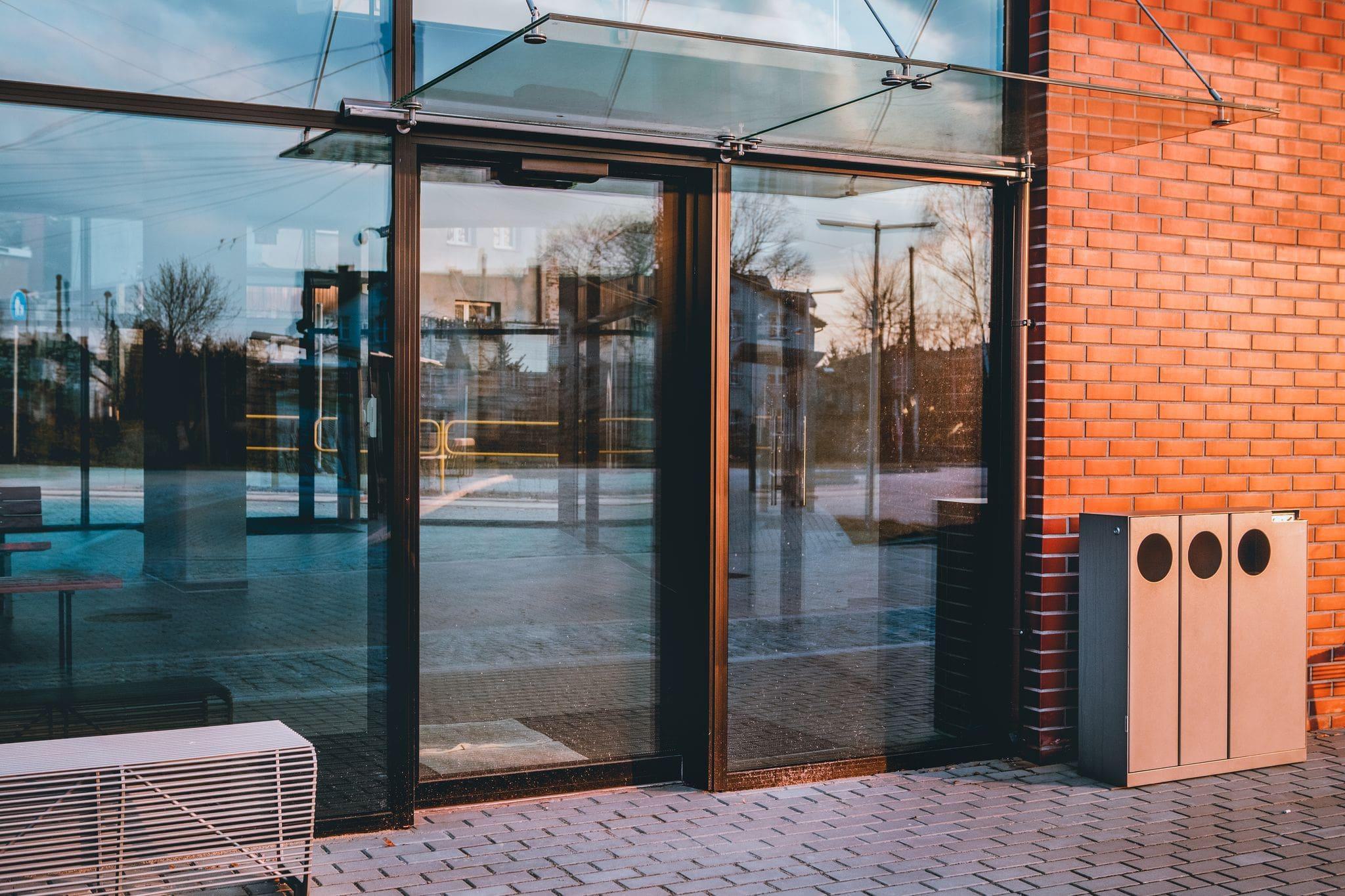 sliding automatic doors in sunny storefront