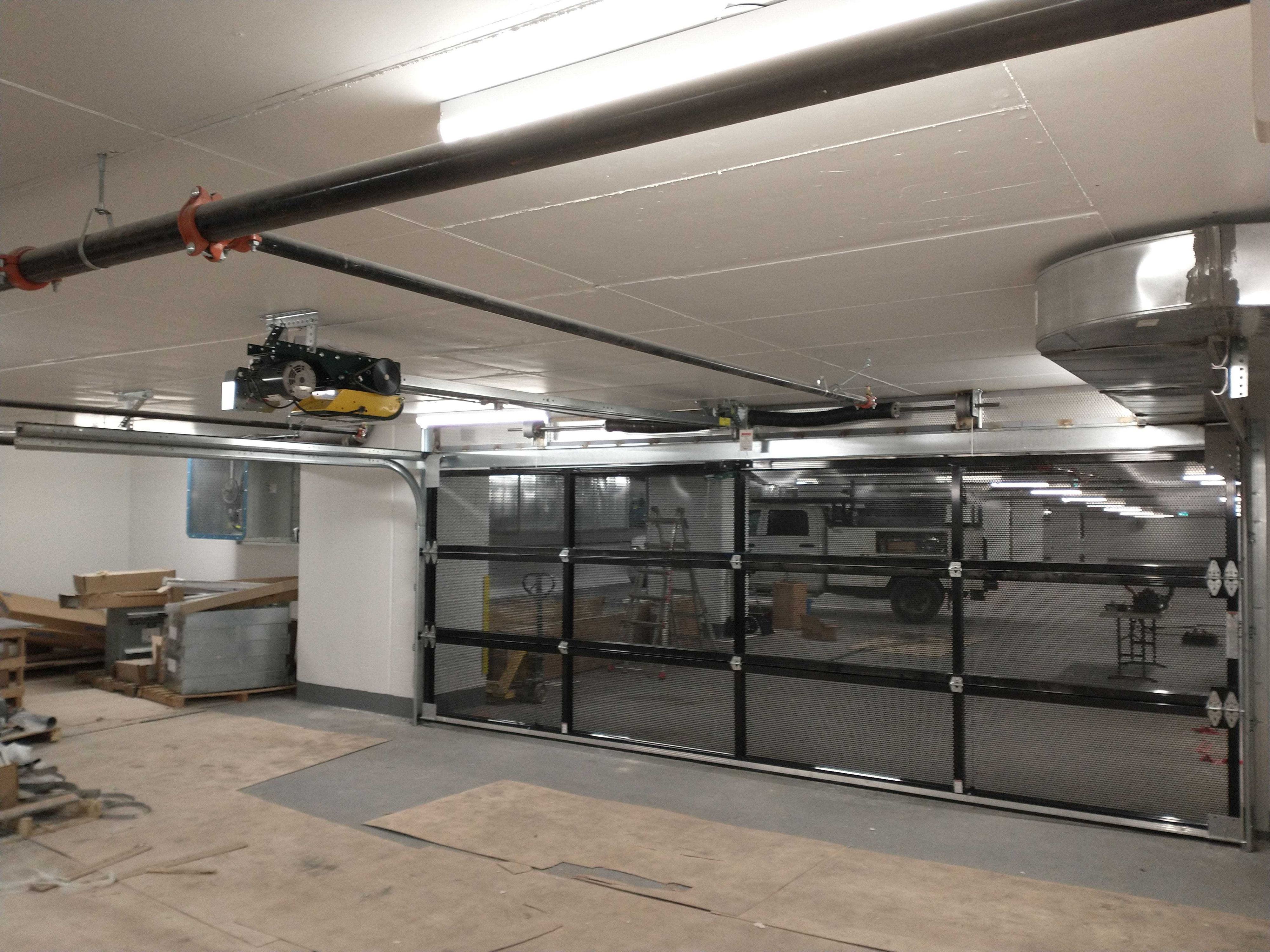 perforated gated underground parking door installation perforated gated underground parking door installation