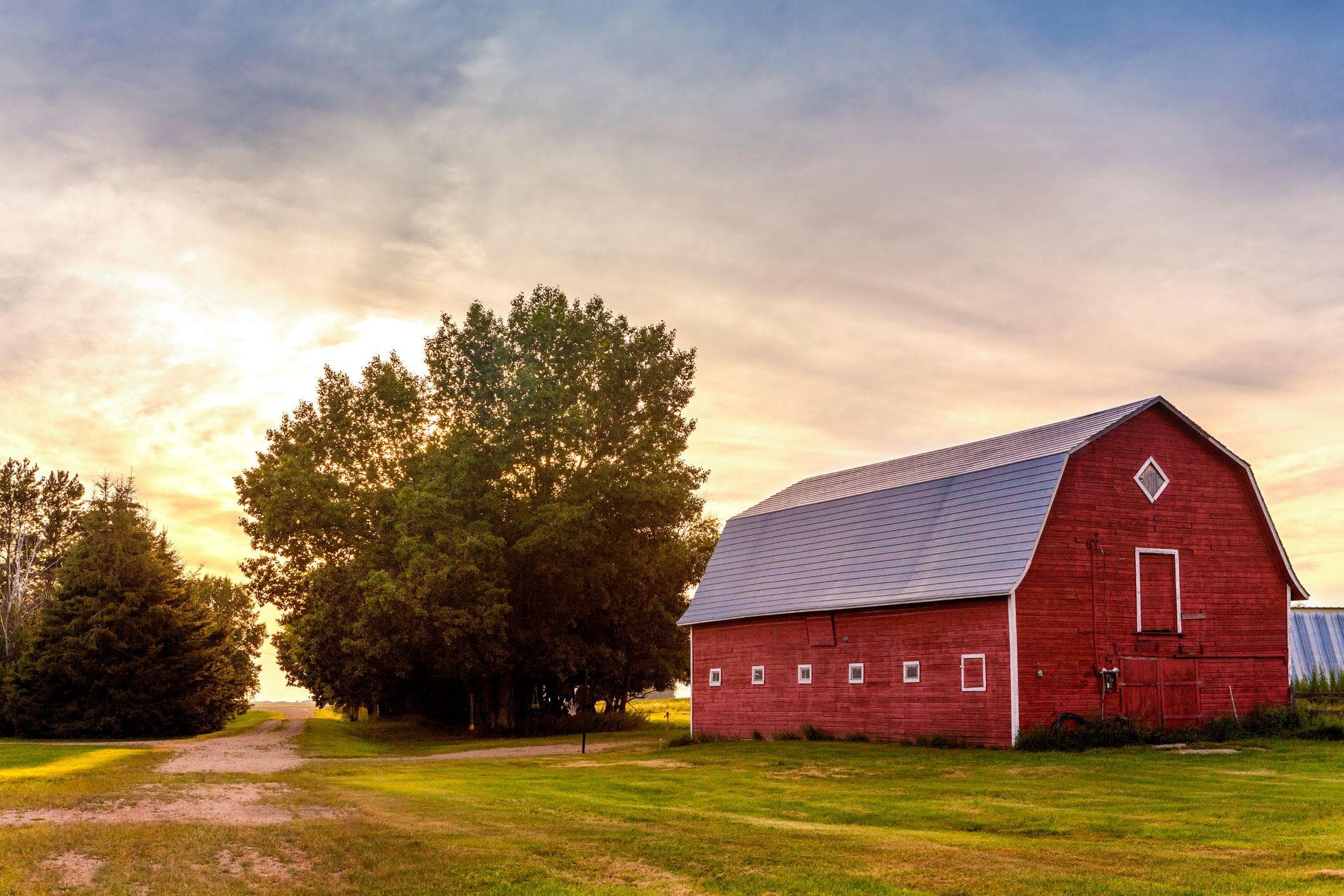red barn wedding venue at sunset