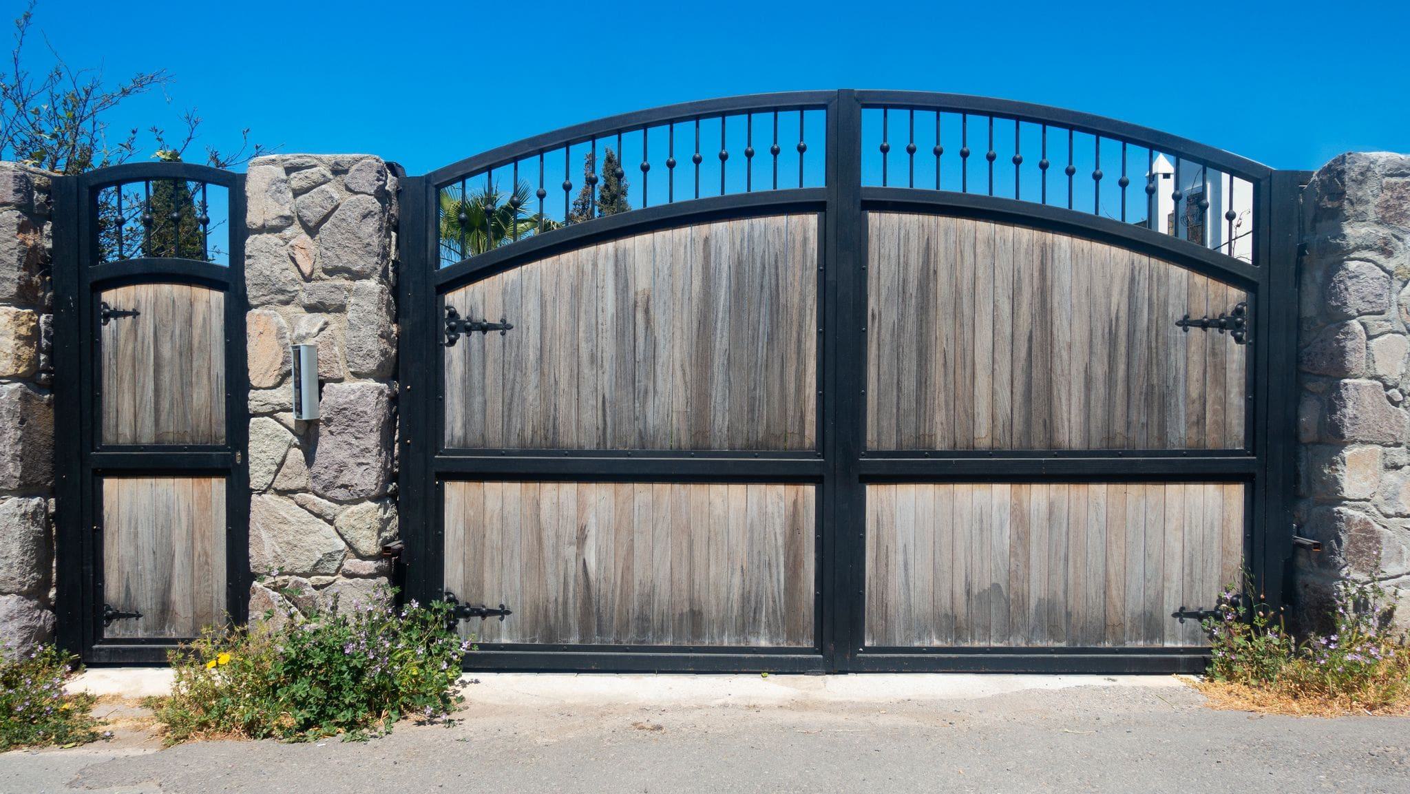 automatic gate with reclaimed wood and brick