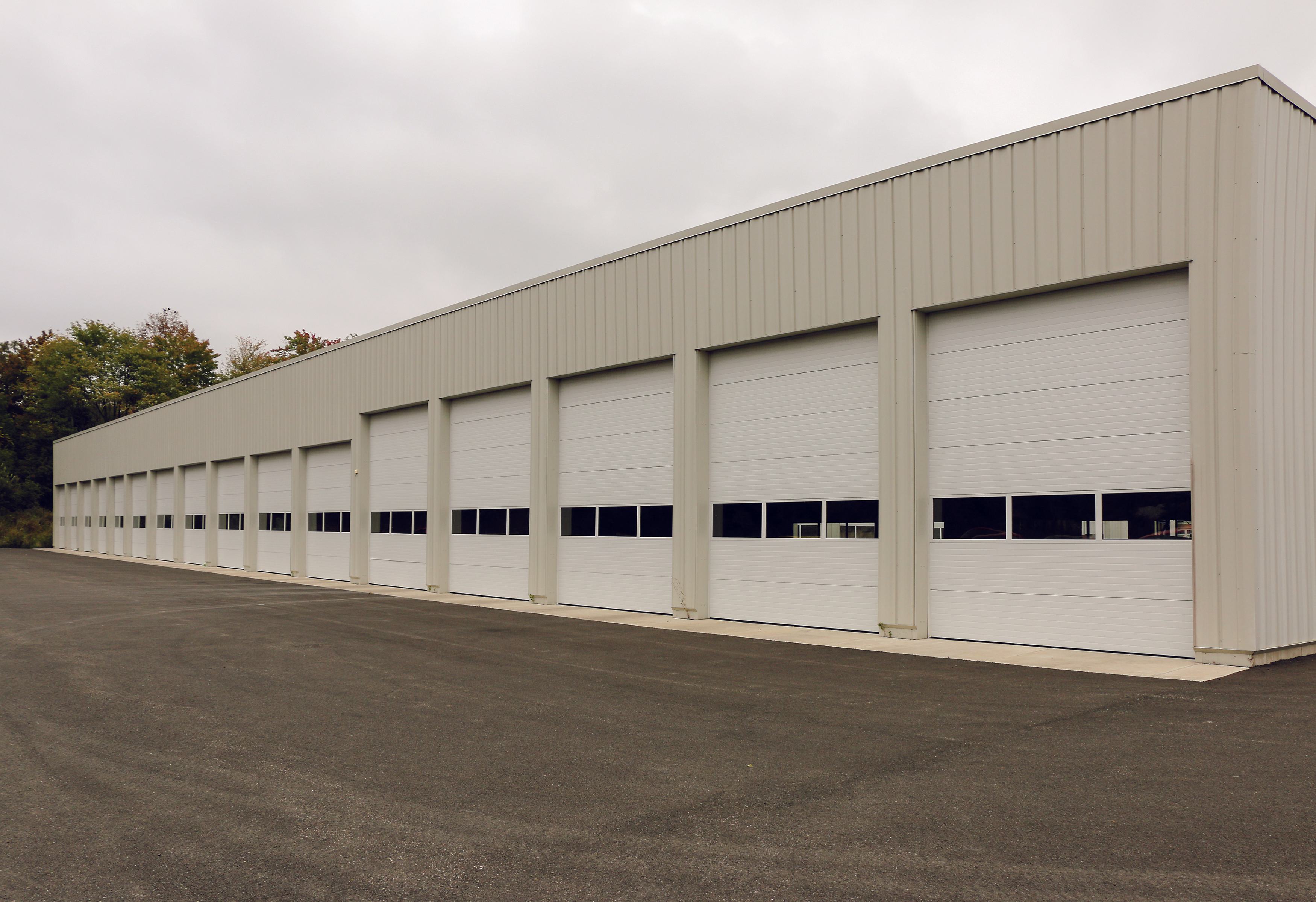 row of commercial door sections at a warehouse