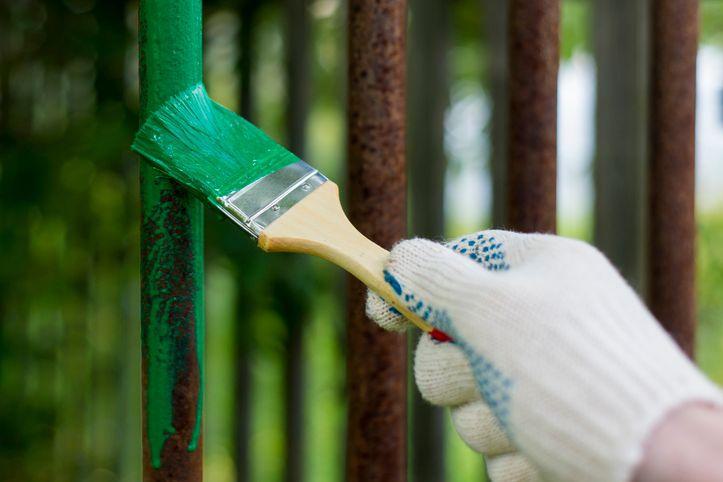 green paint on rusty iron gate green paint on rusty iron gate