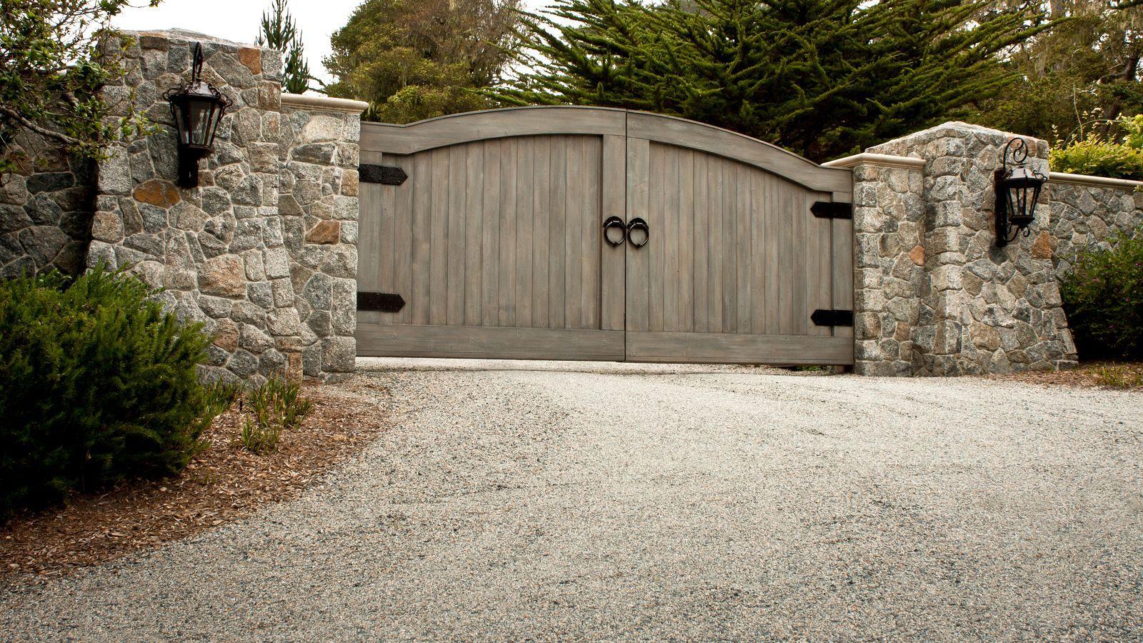 rustic wood gate with ornamental hardware