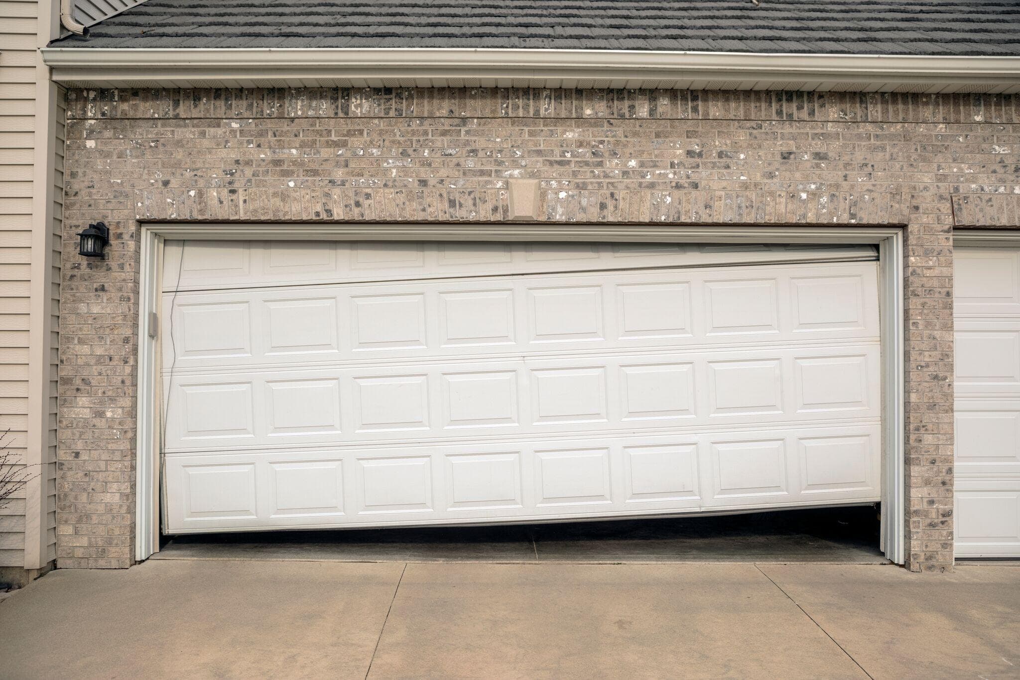sagging and uneven garage door