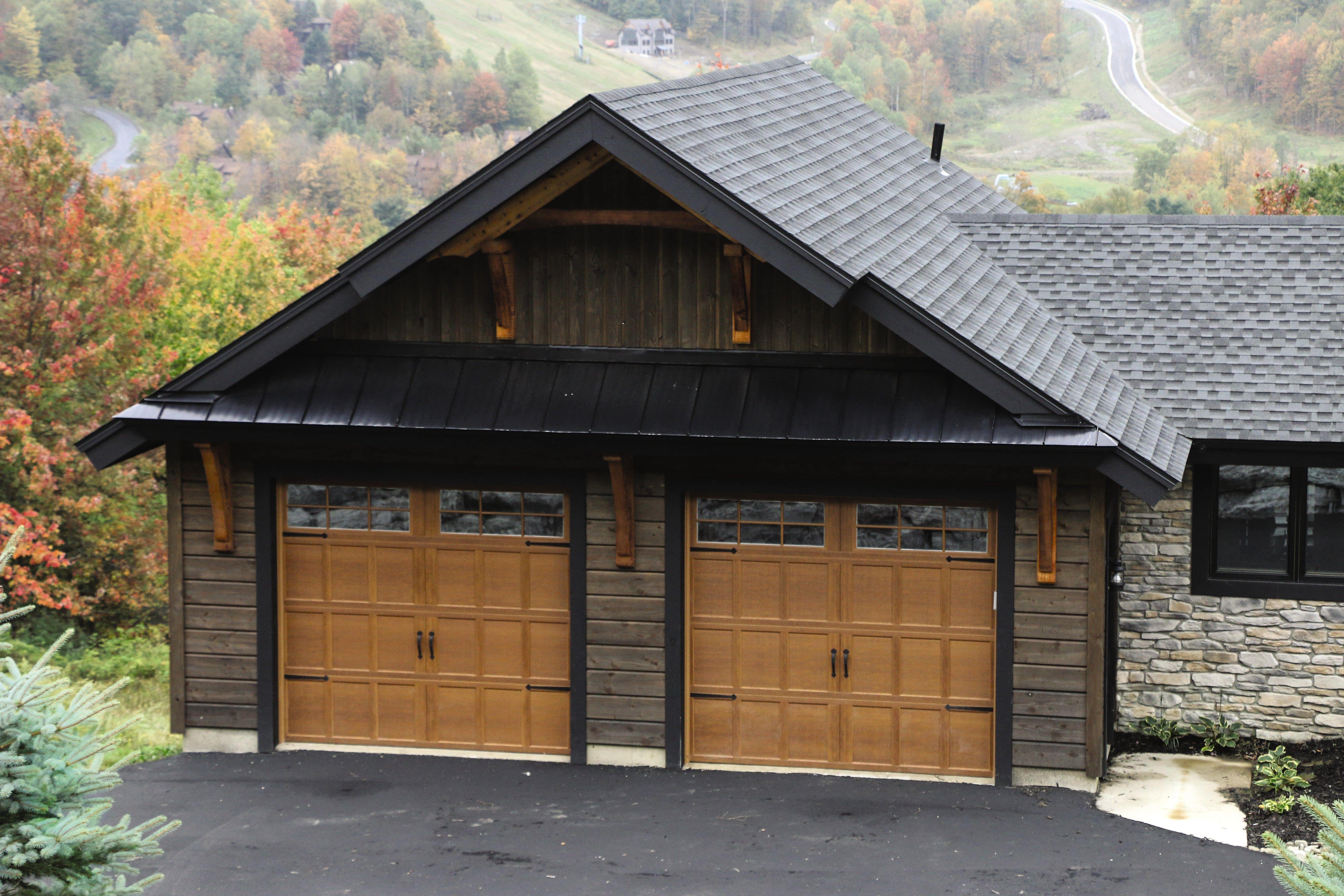 a beautiful new wayne dalton garage door with a scenic mountain forest view in the background
