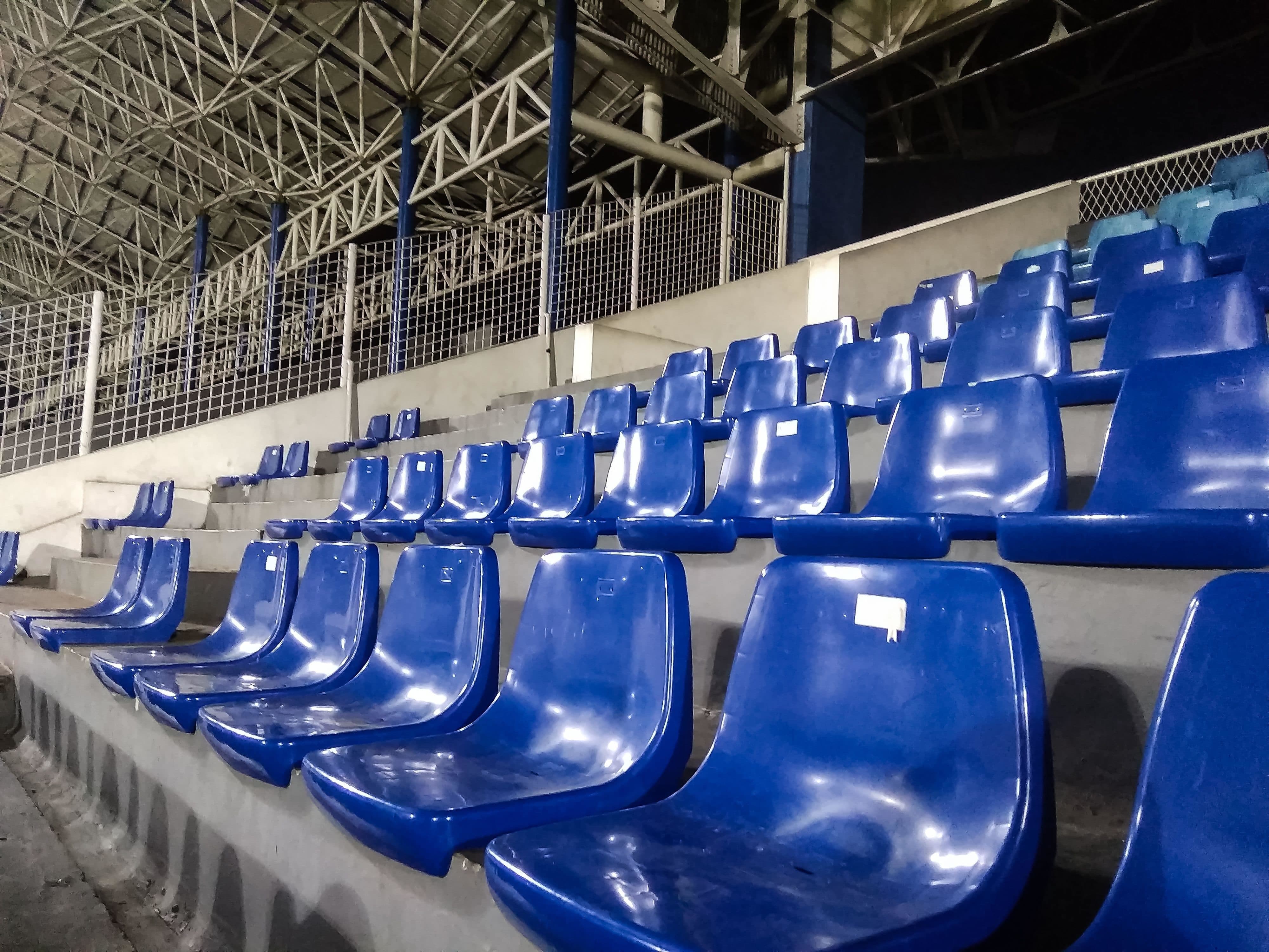 blue seating inside of entertainment venue