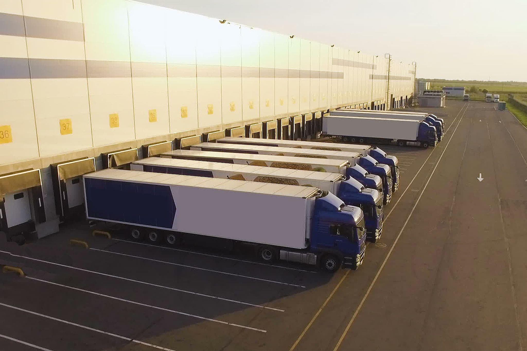 trucking waiting at loading dock of shipping distribution warehouse