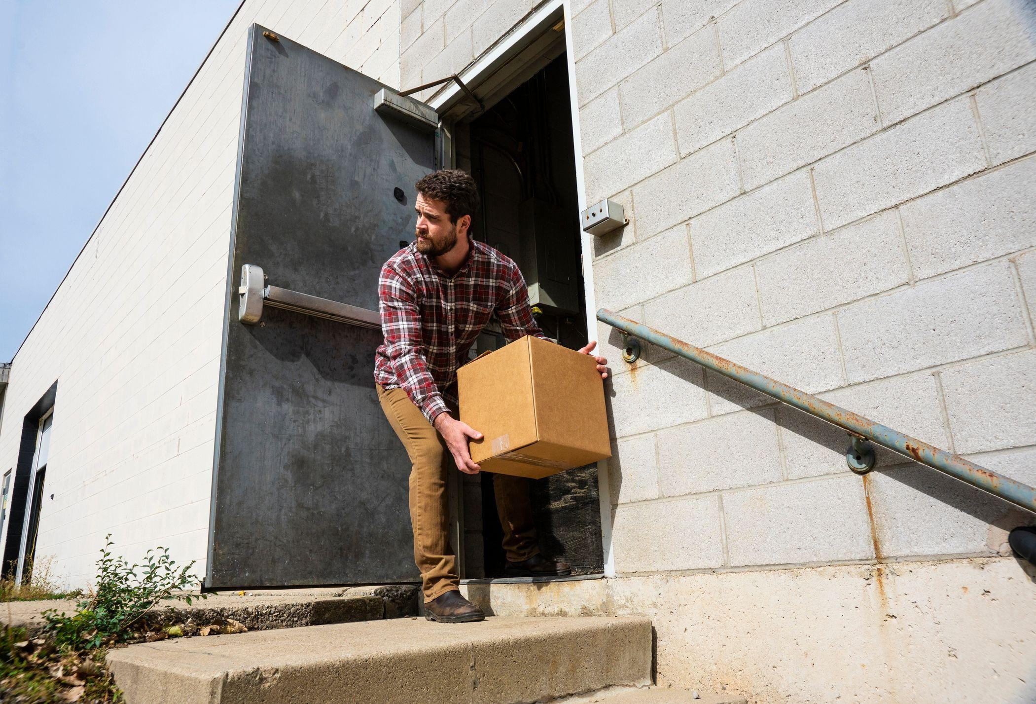 employee using pedestrian door to accept delivery