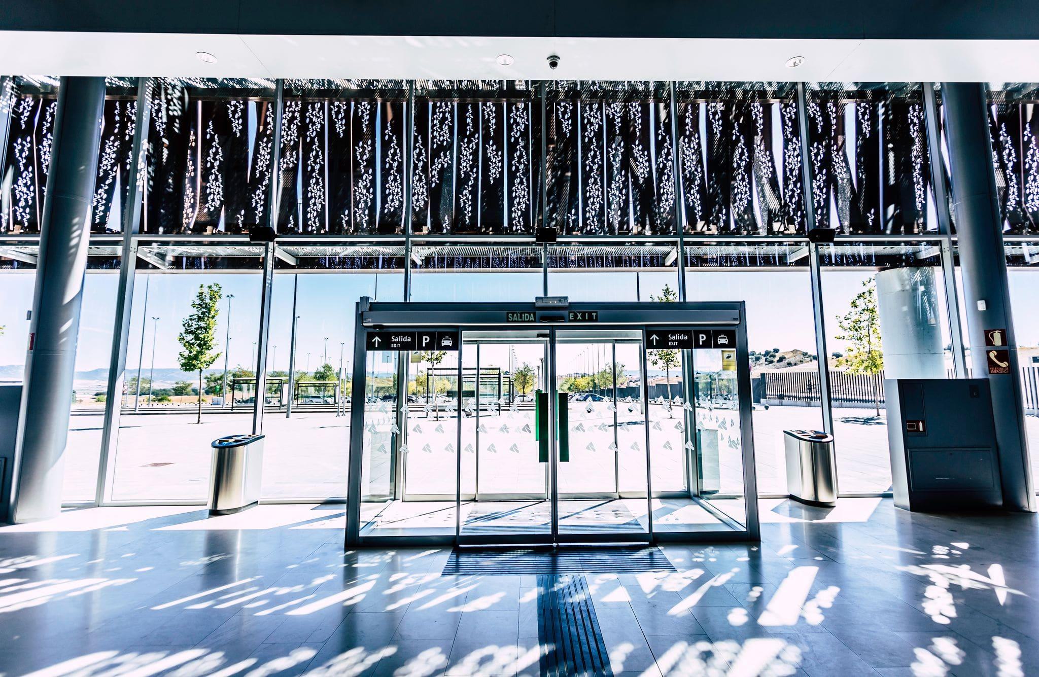 large commercial entrance with automatic glass sliding doors large commercial entrance with automatic glass sliding doors