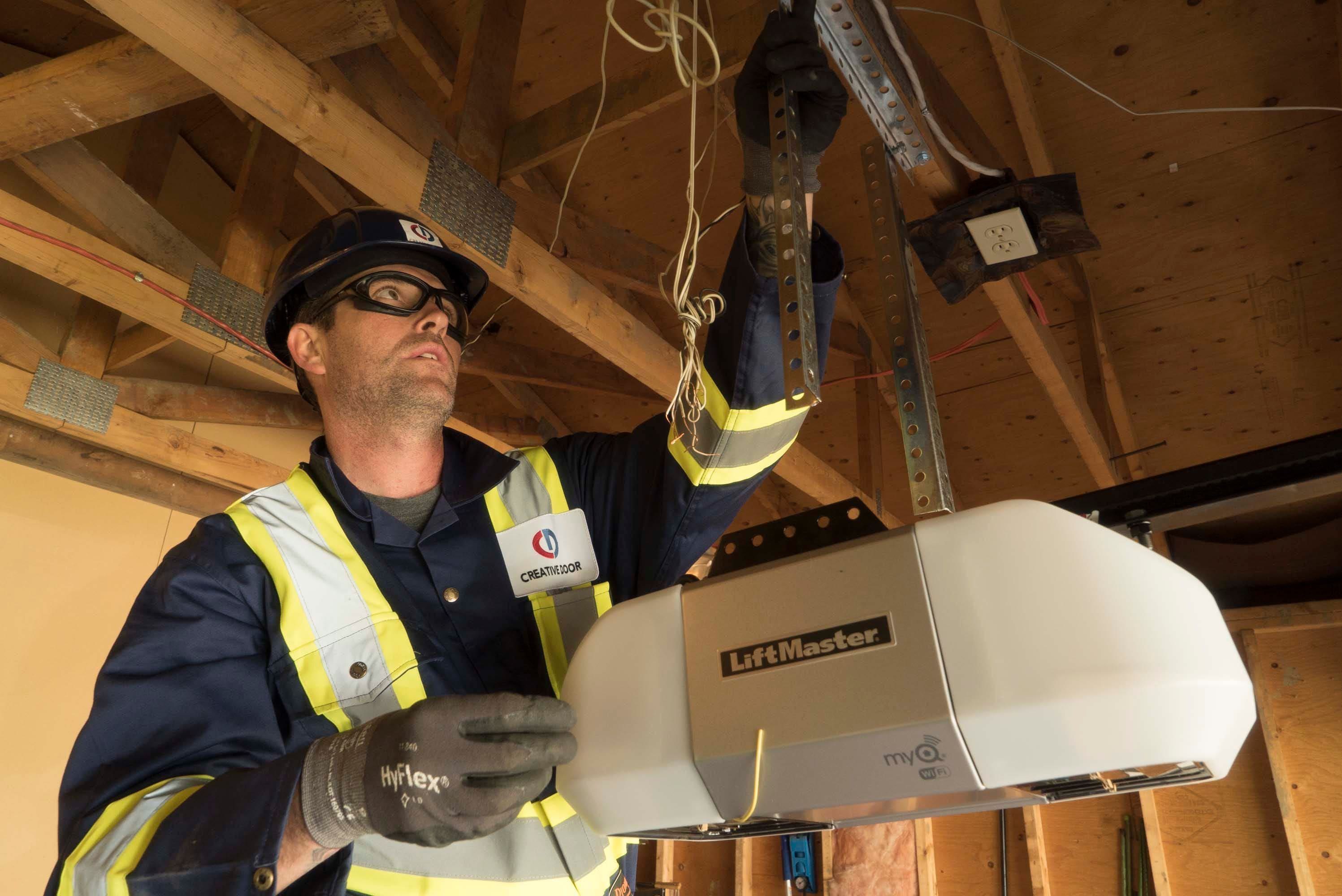 Creative Door technician to the rescue fixing an opener