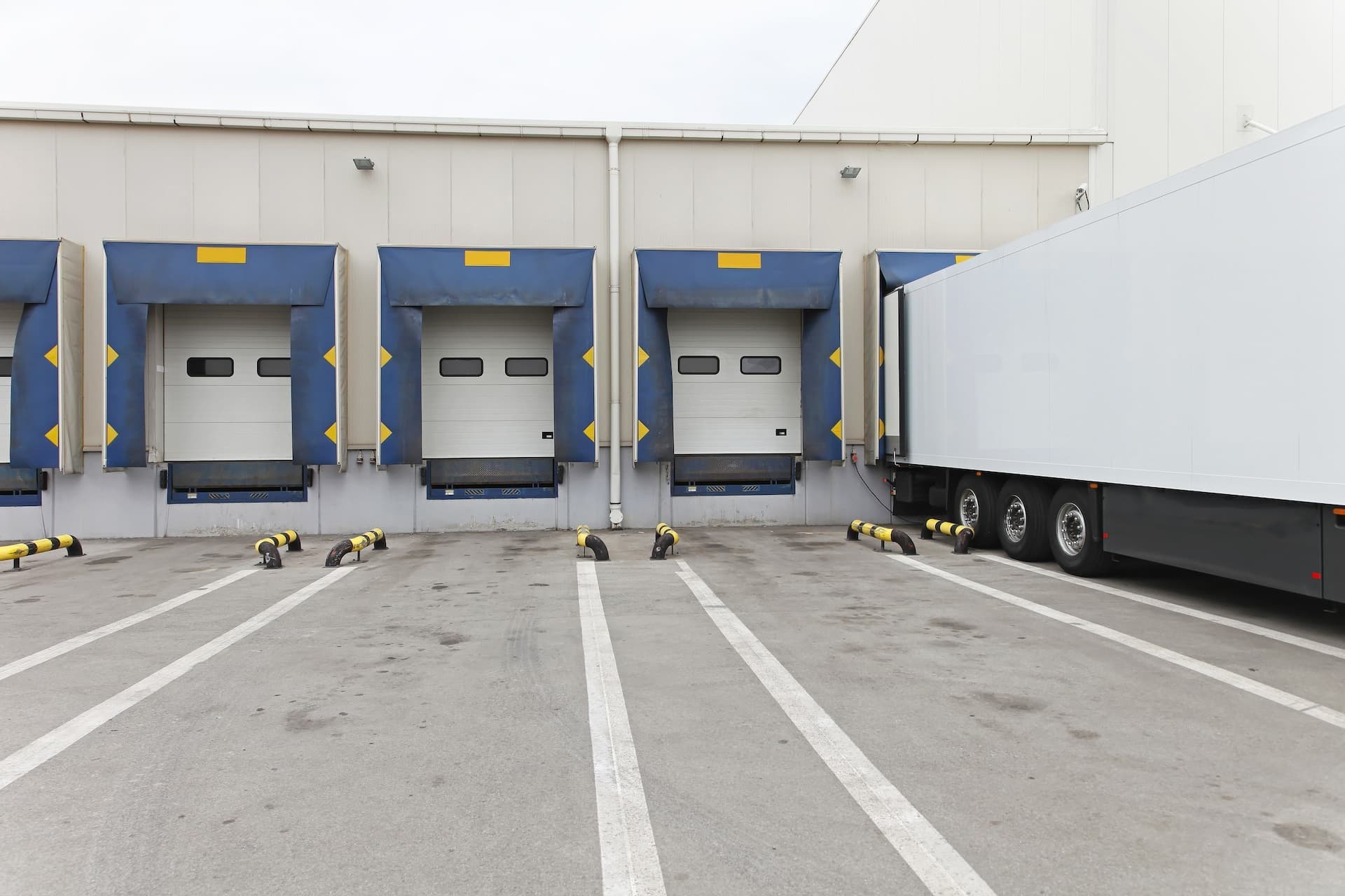 truck docked at loading bay and secured with loading dock restraints