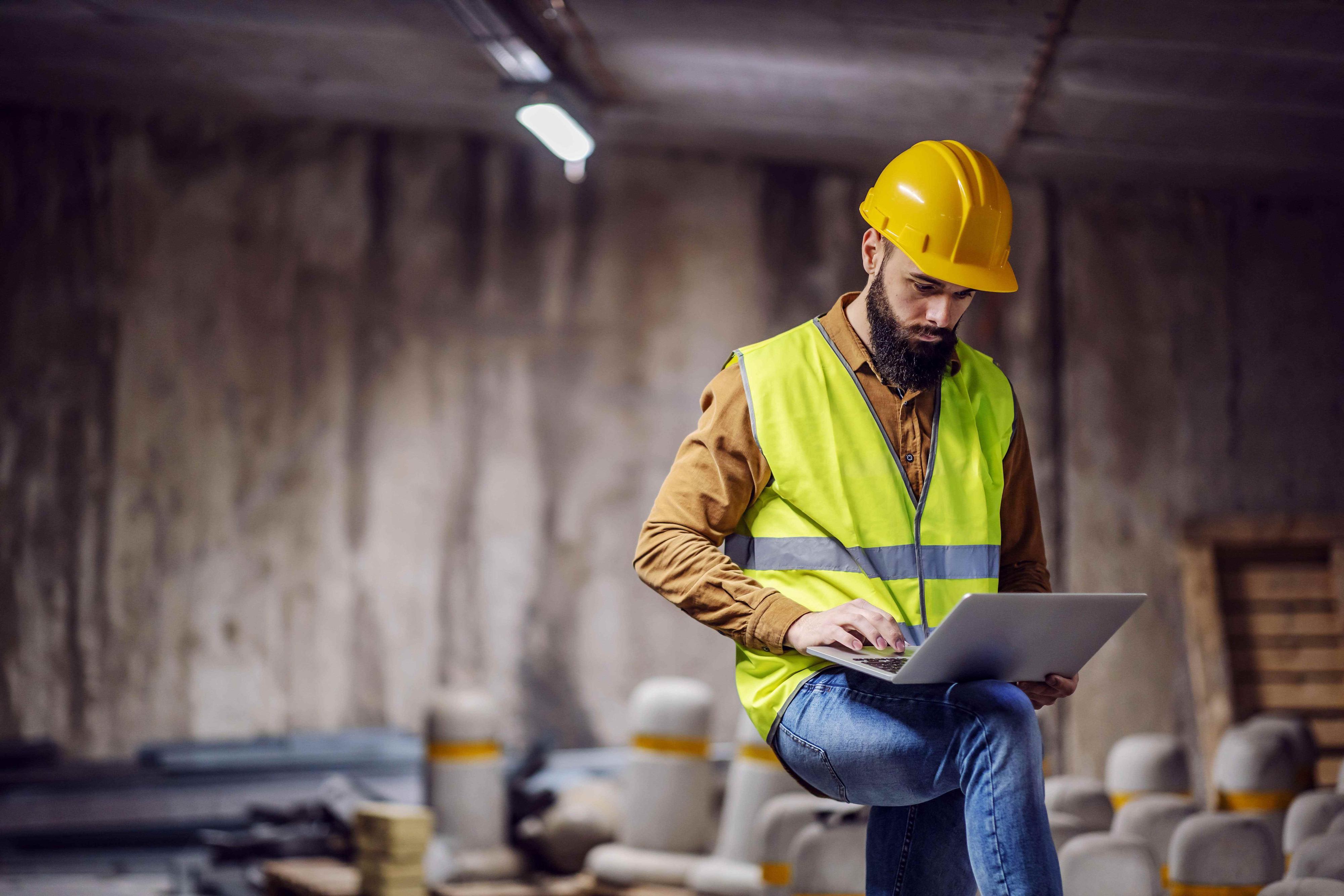worksite manager in underground parking under construction worksite manager in underground parking under construction