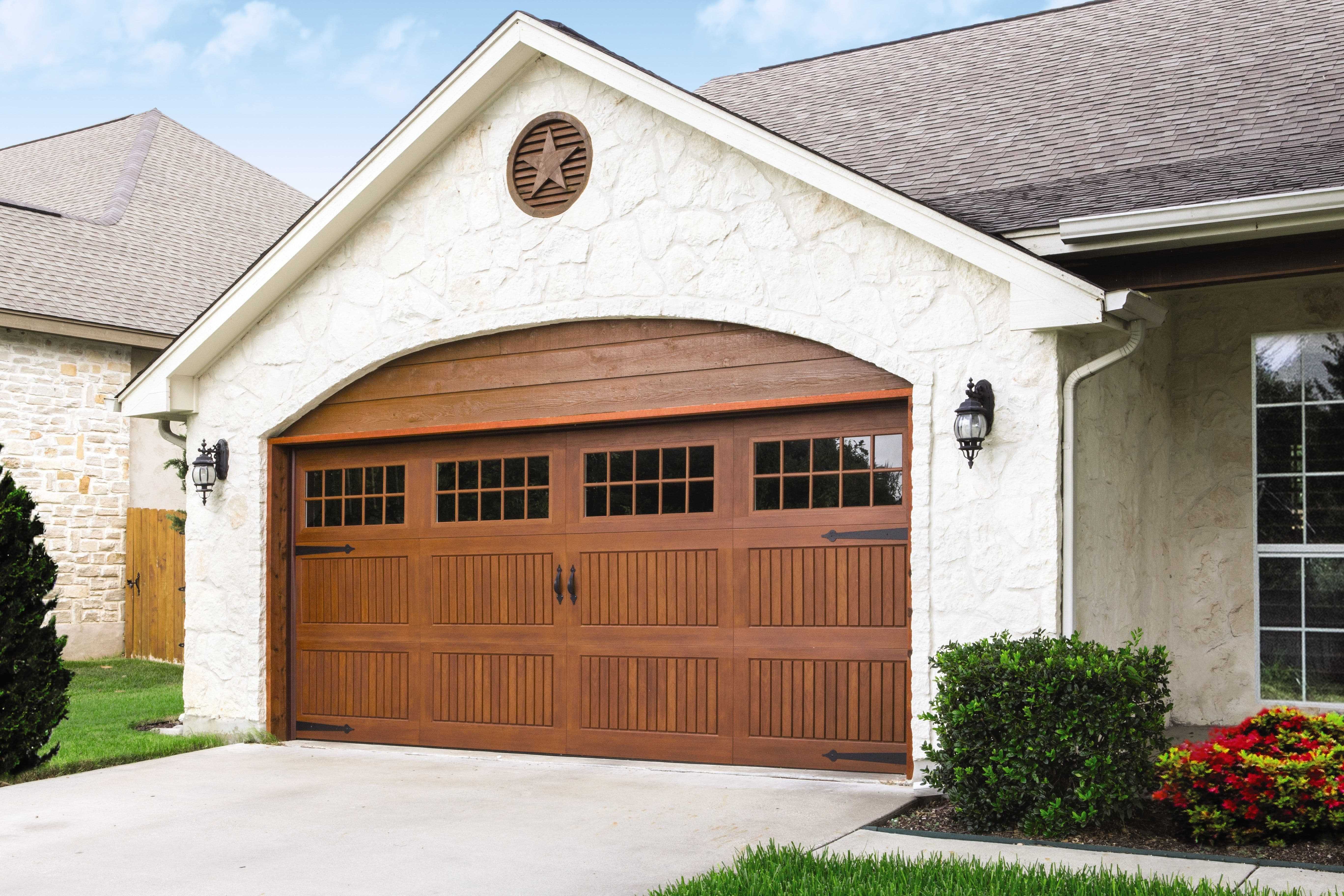 custom wood door with black metal hardware and decorative elements