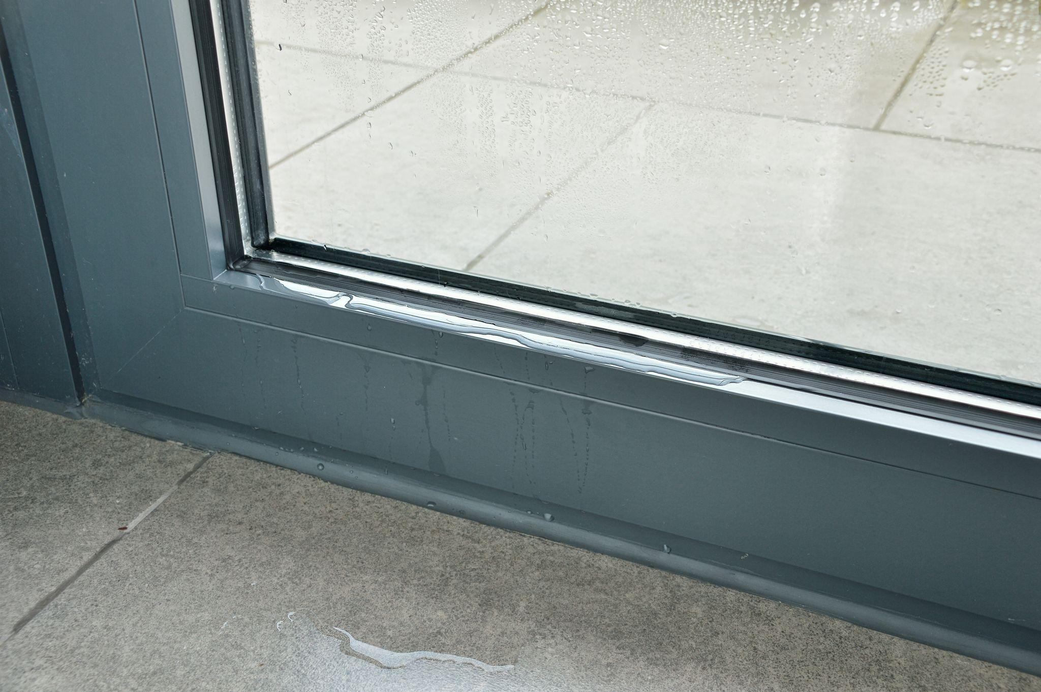 water leaking through glass panel of pedestrian door water leaking through glass panel of pedestrian door