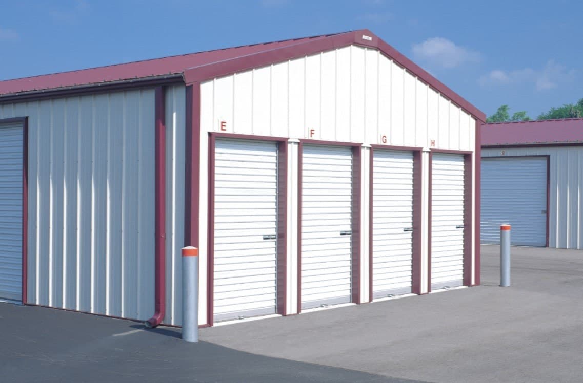 white entry doors on side of warehouse units