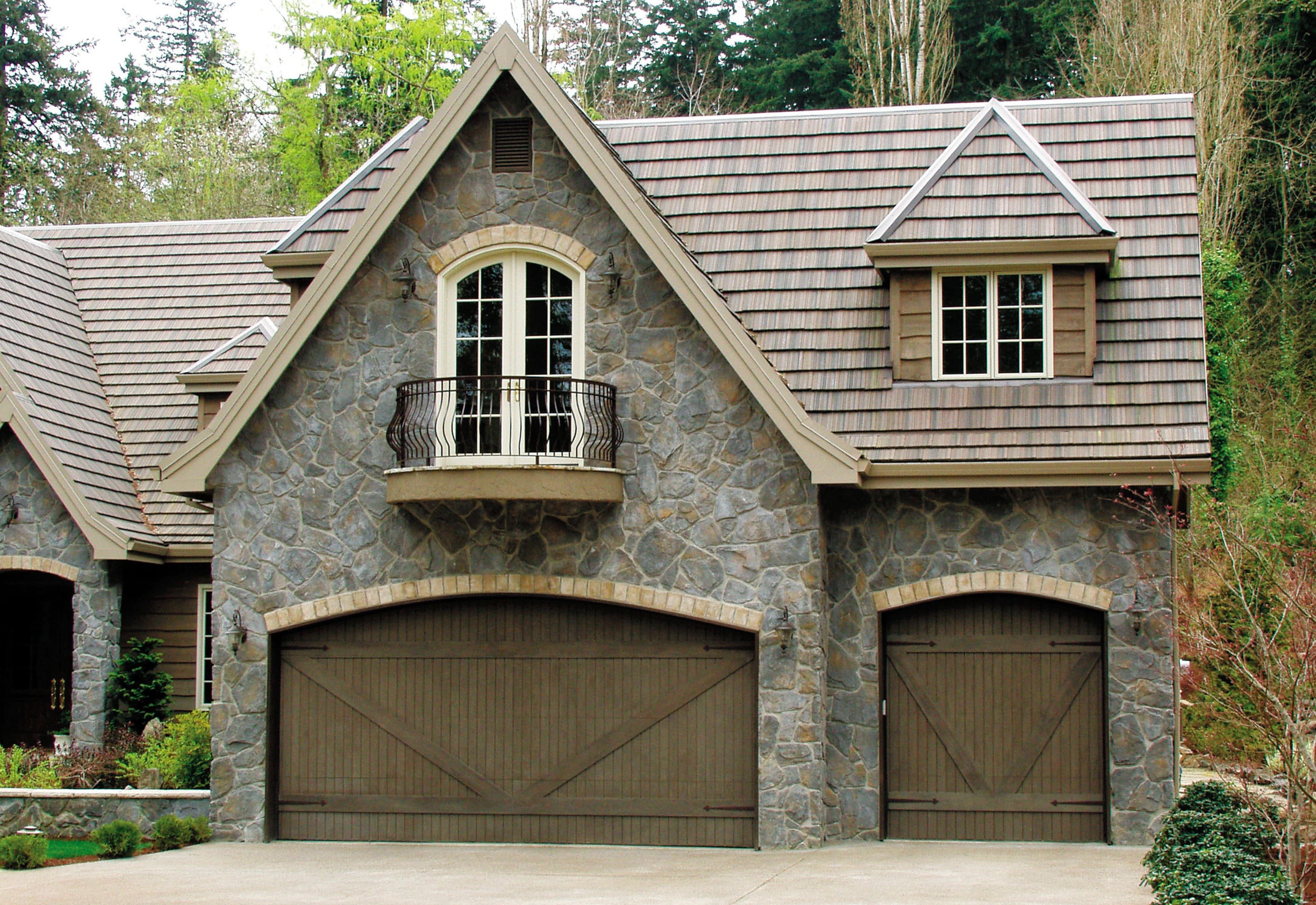 heritage house with custom wood garage doors