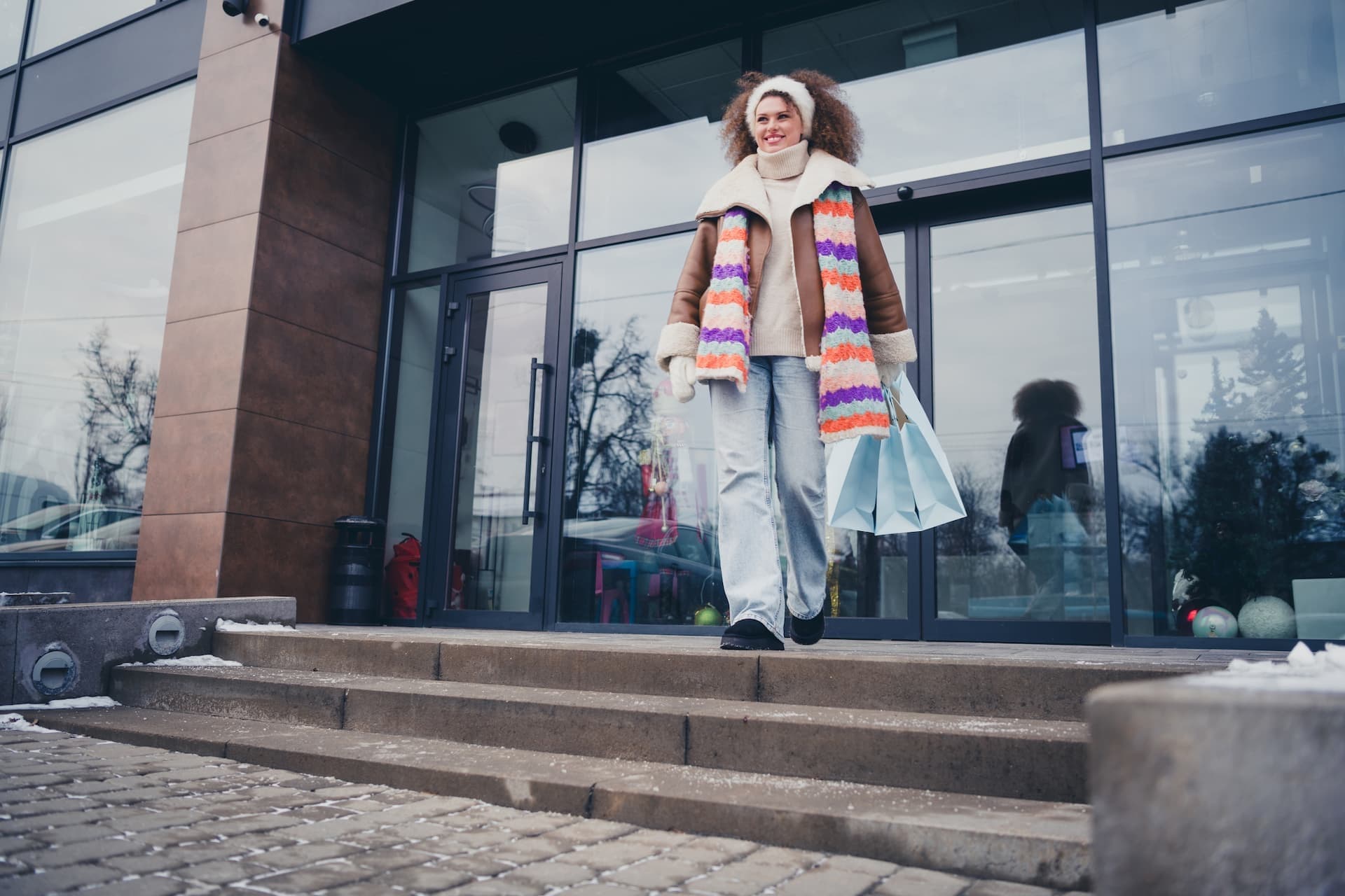 young woman shopping and walking outdoors in winter weather
