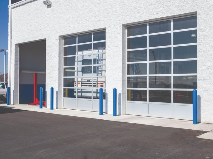 Automotive facility with aluminum sectional doors