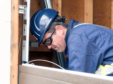 CDS technician installing garage door cable