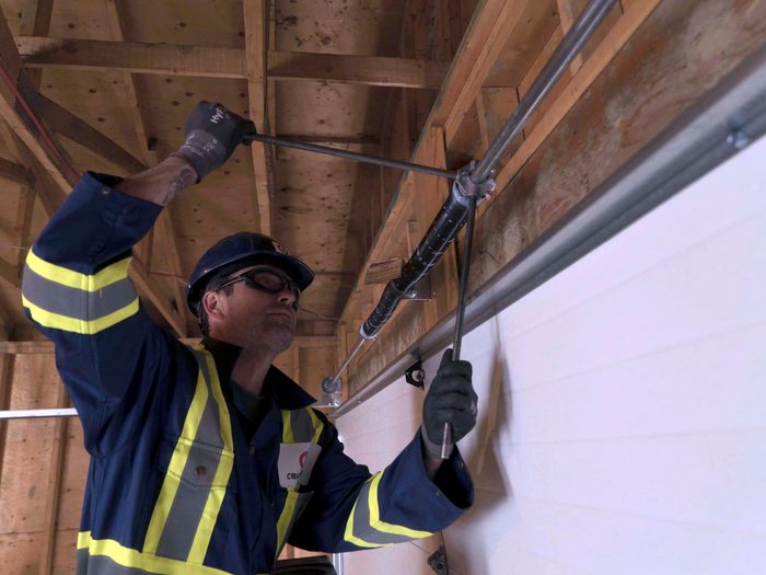 CDS technician installing garage door spring