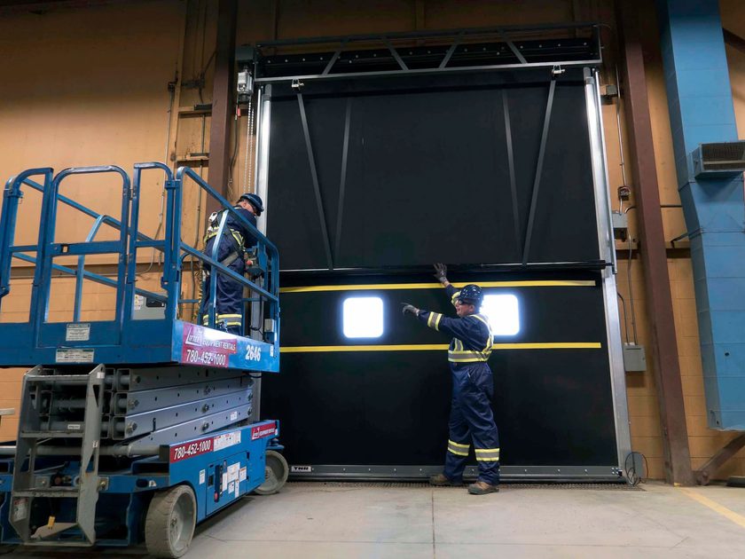 CDS technicians servicing loading dock door