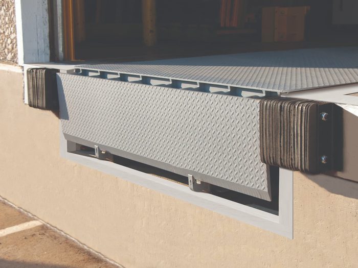 Dalton Dock bumpers next to mechanical pit leveler