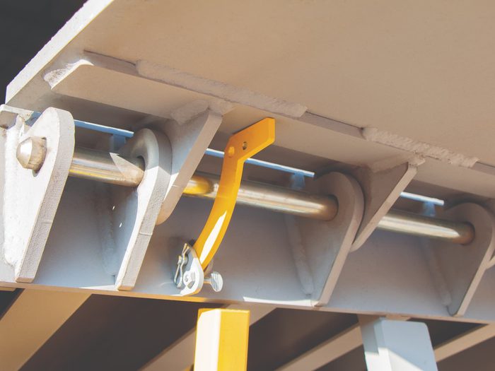 Dalton Dock pit leveler mechanism beneath loading dock platform