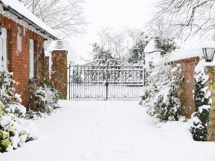 Driveway to rural house in snow
