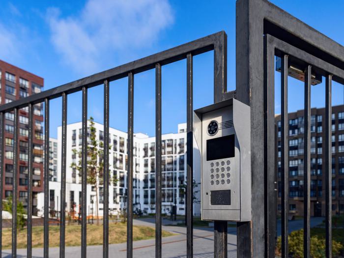 Electronic lock with buttons and intercom on the metal fence gate